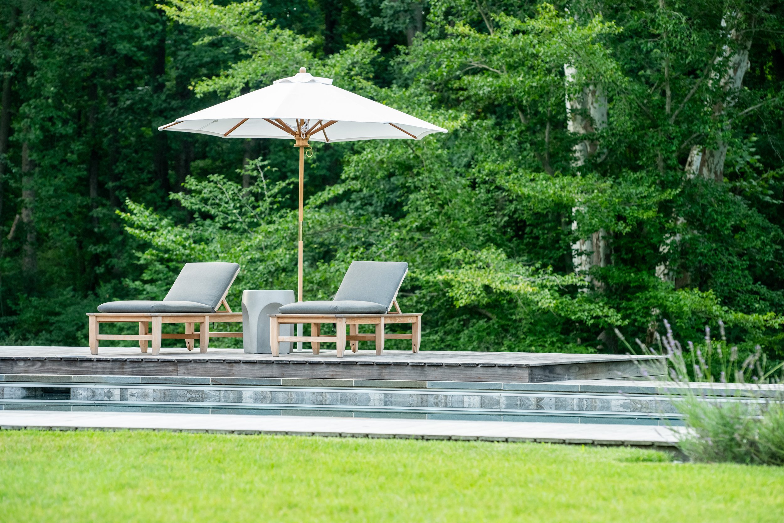 Bel Air estate with in-ground blue stone pool by FORM Garden Design.