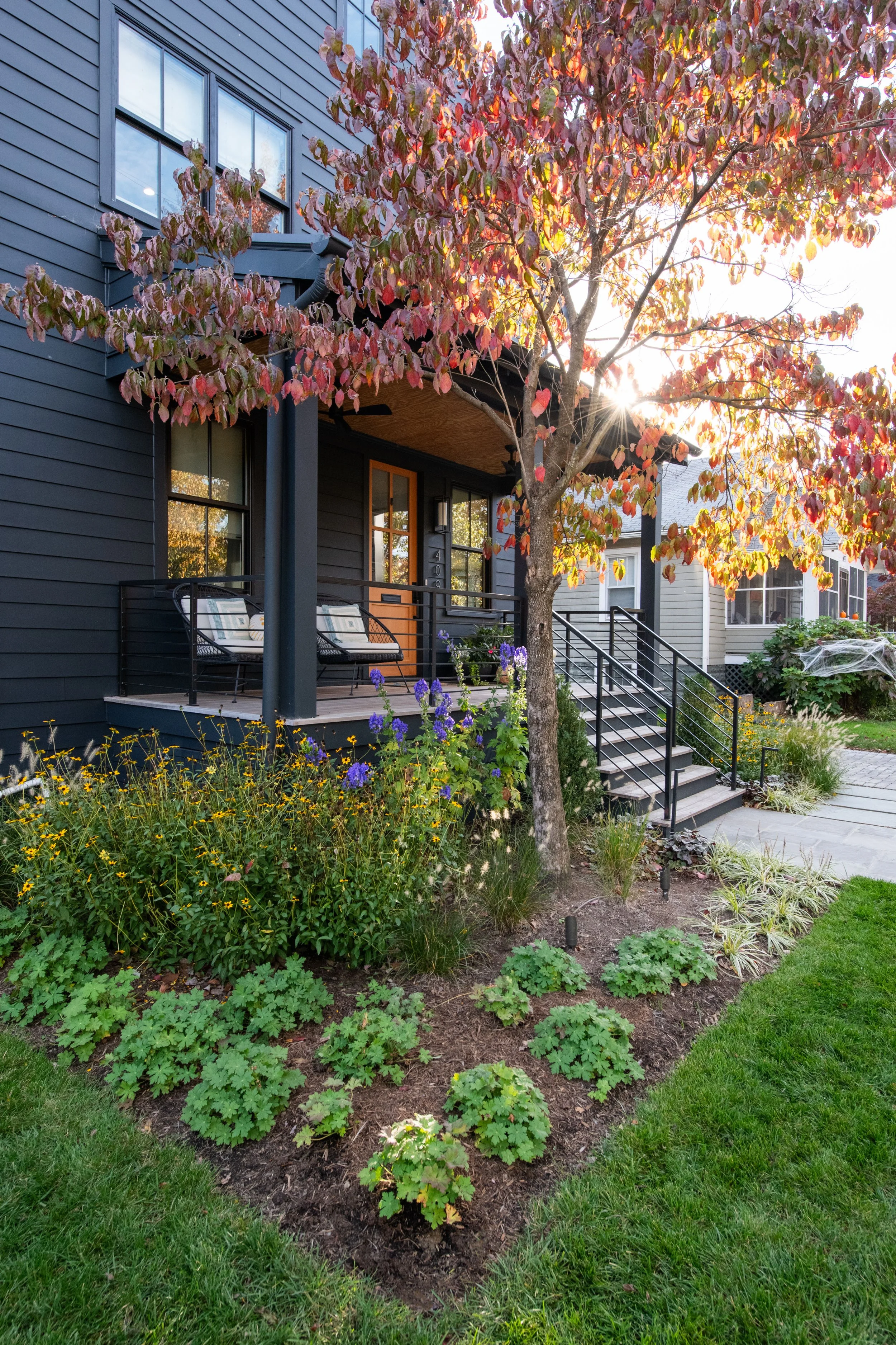 FORM Garden Design softened this modern black farmhouse through the use of soft perennials and grasses.