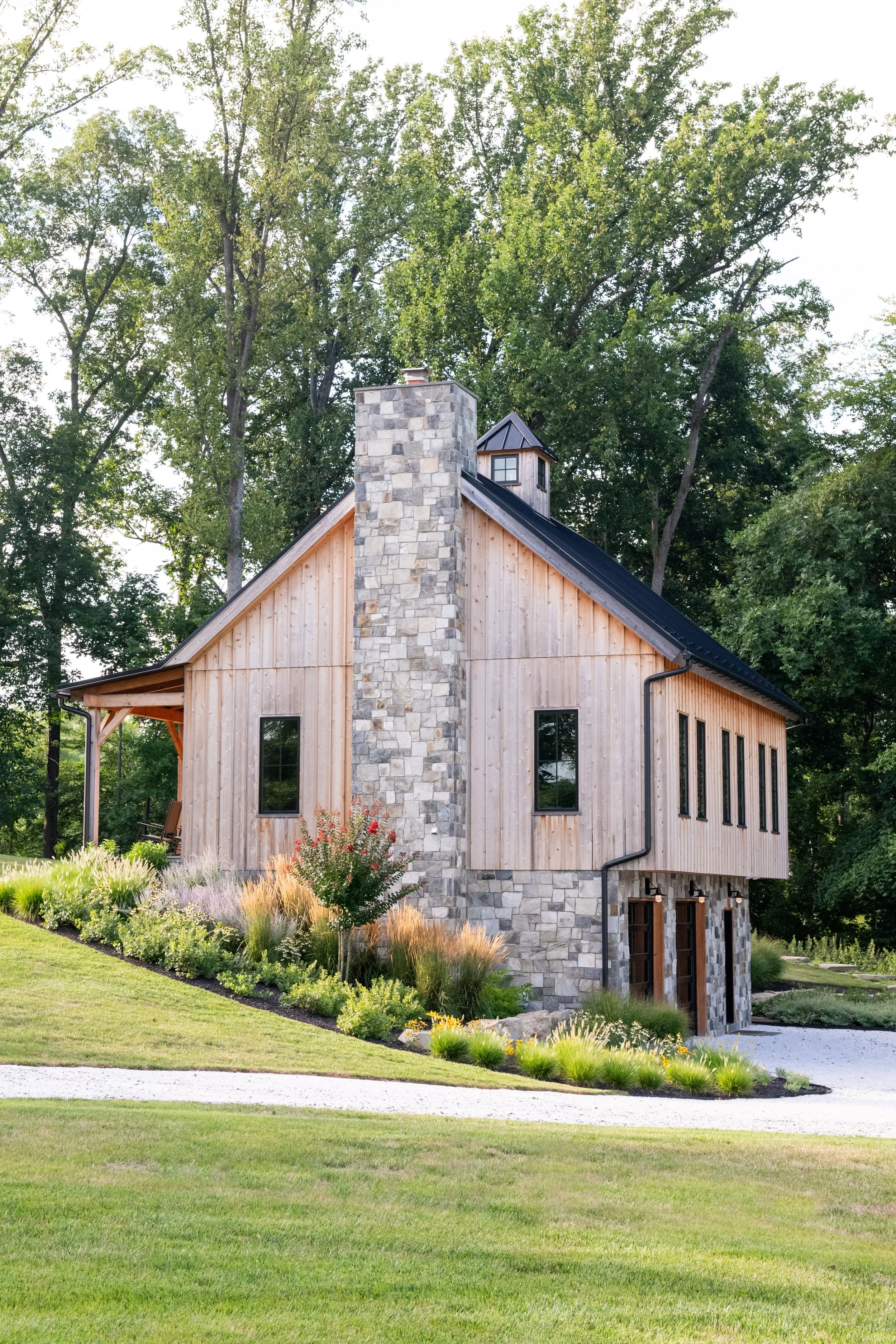 Stone chimney on the wood party barn in Bel Air, Maryland.  Landscape by FORM Garden Design.  
