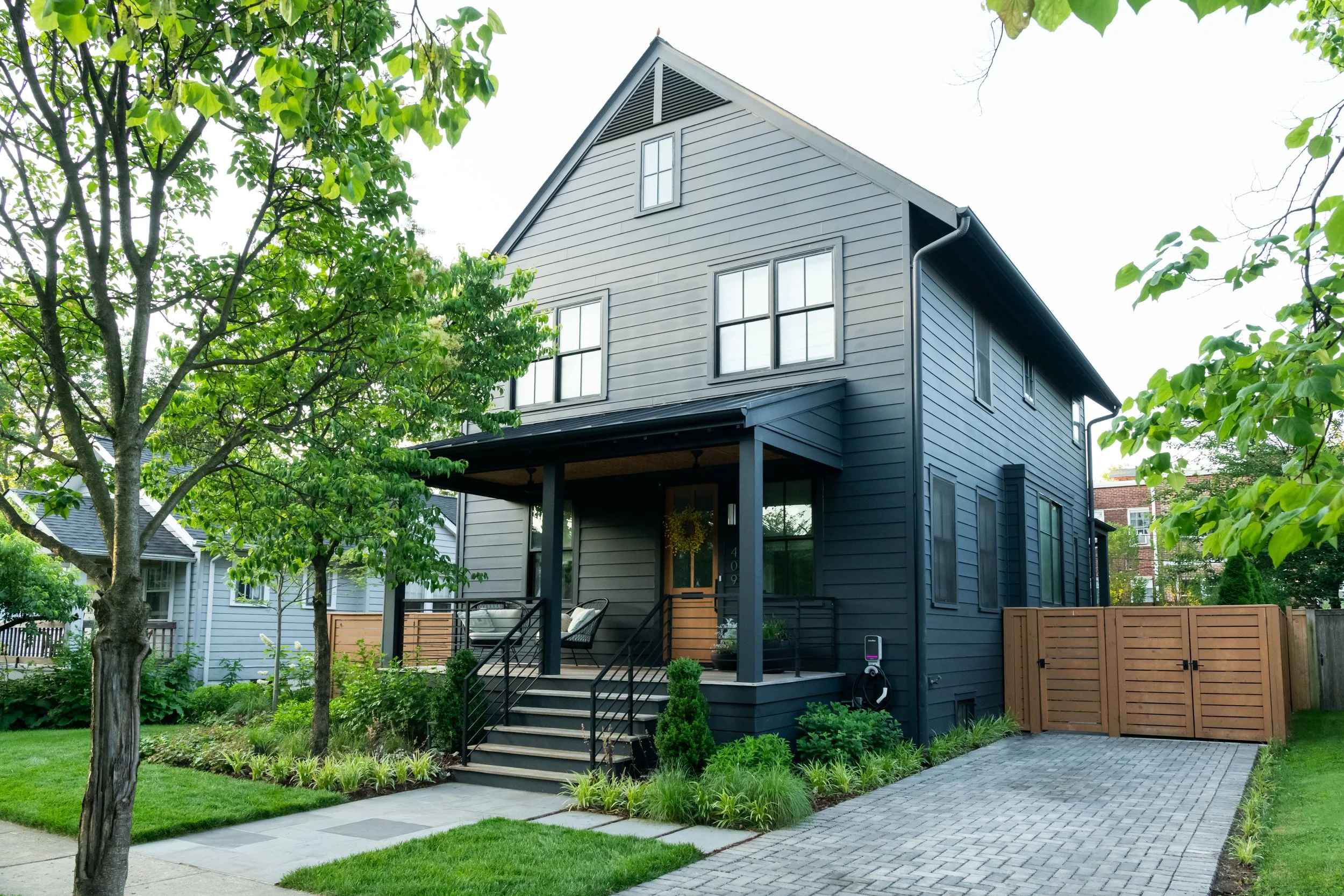 The project included complete hardscaping with a driveway, place to hide trash receptacles, entry to the home, and circulation paths throughout.  Designed by FORM Garden Design.