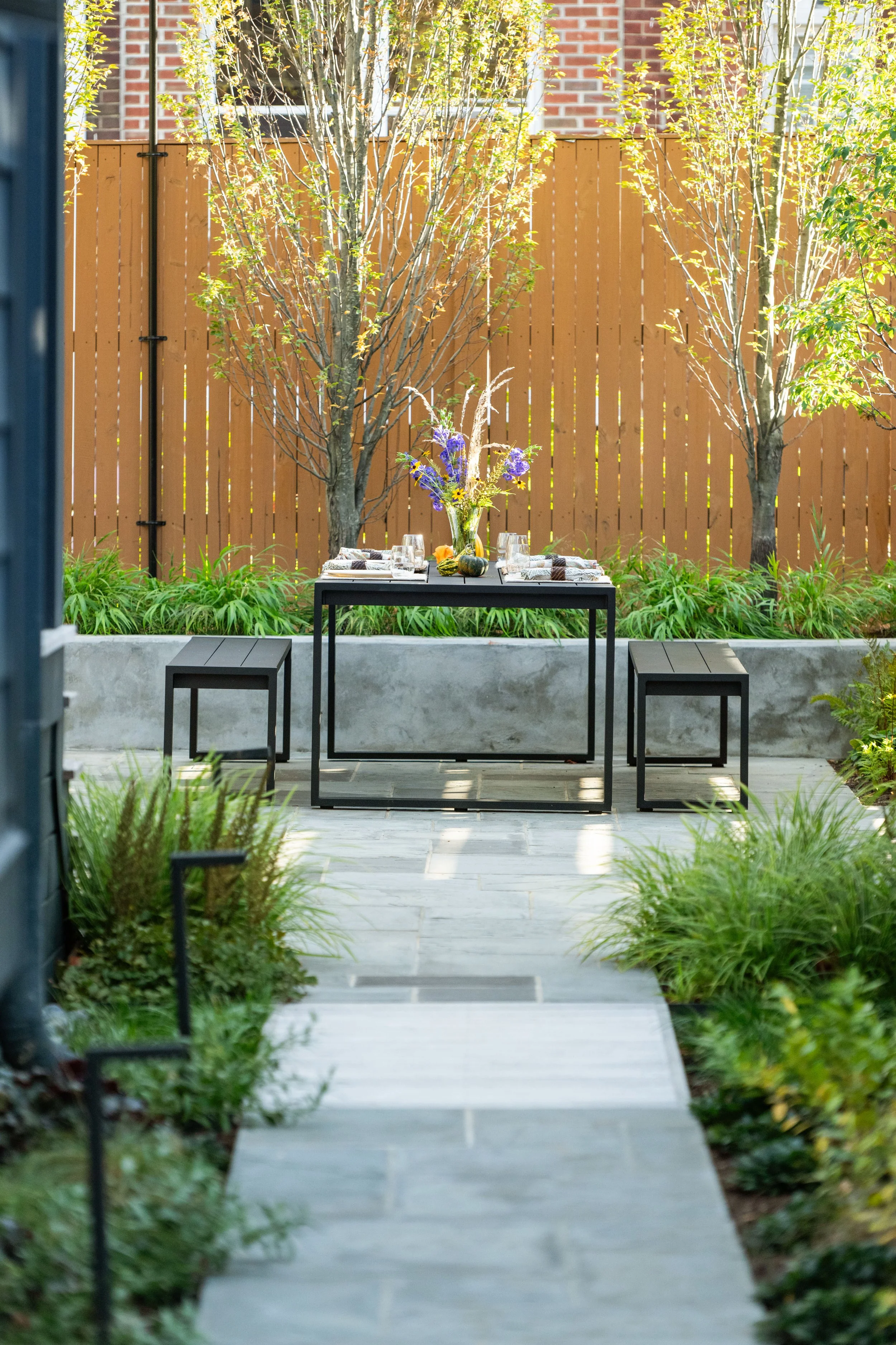 Outdoor dining table and landscape architecture by FORM Garden Design.