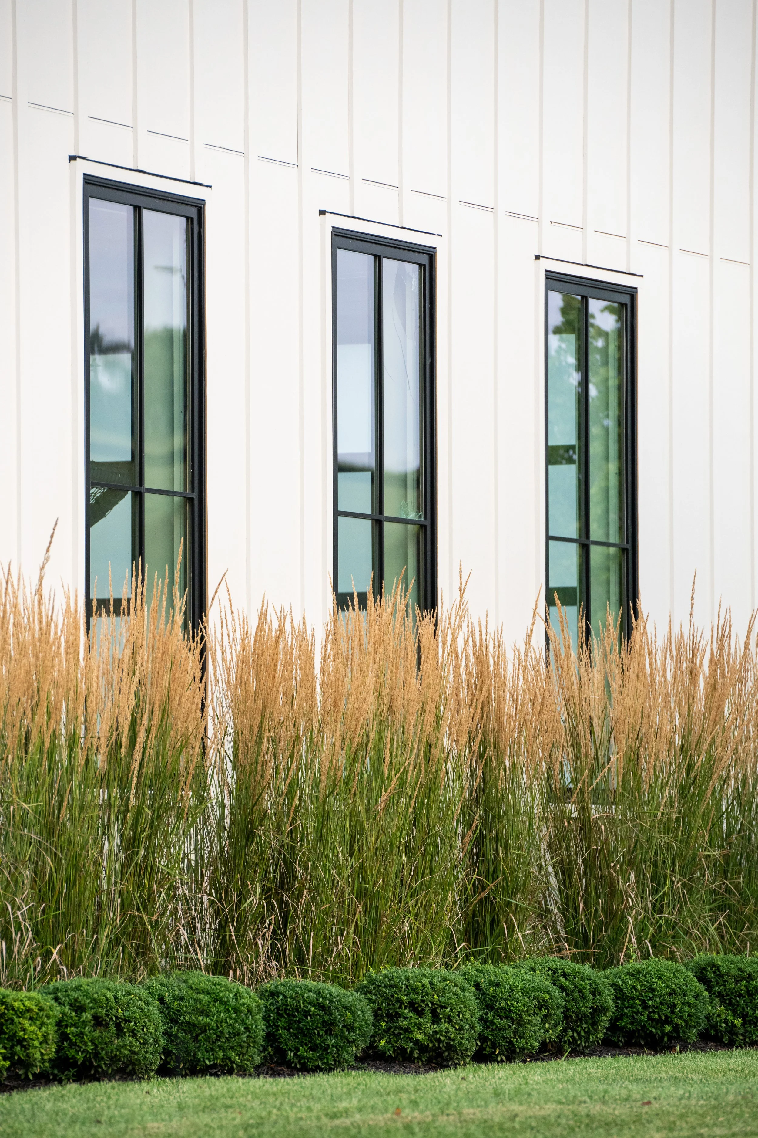 Natural, modern planting on a Tudor Home in Maryland, by FORM Garden Design.