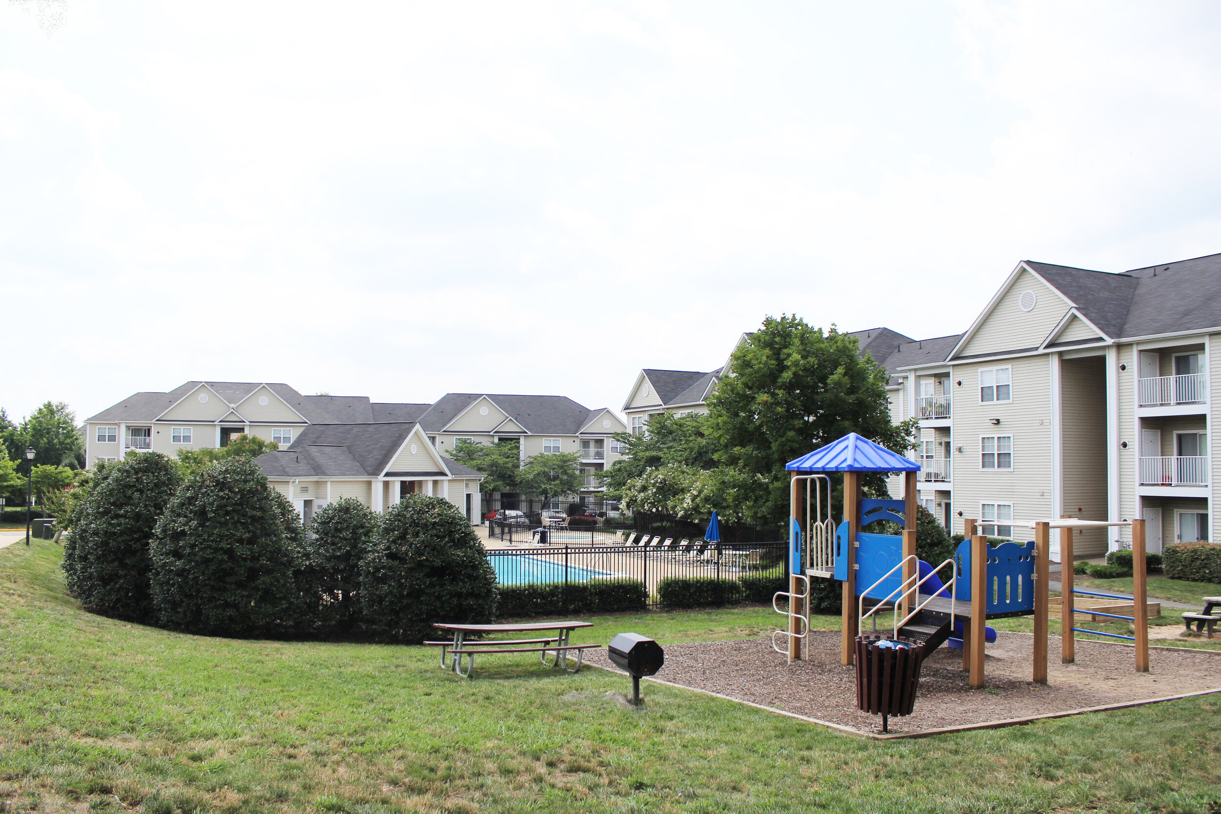  Potomac Station Apartments in Loudoun County, VA feature mature trees and open green spaces.  