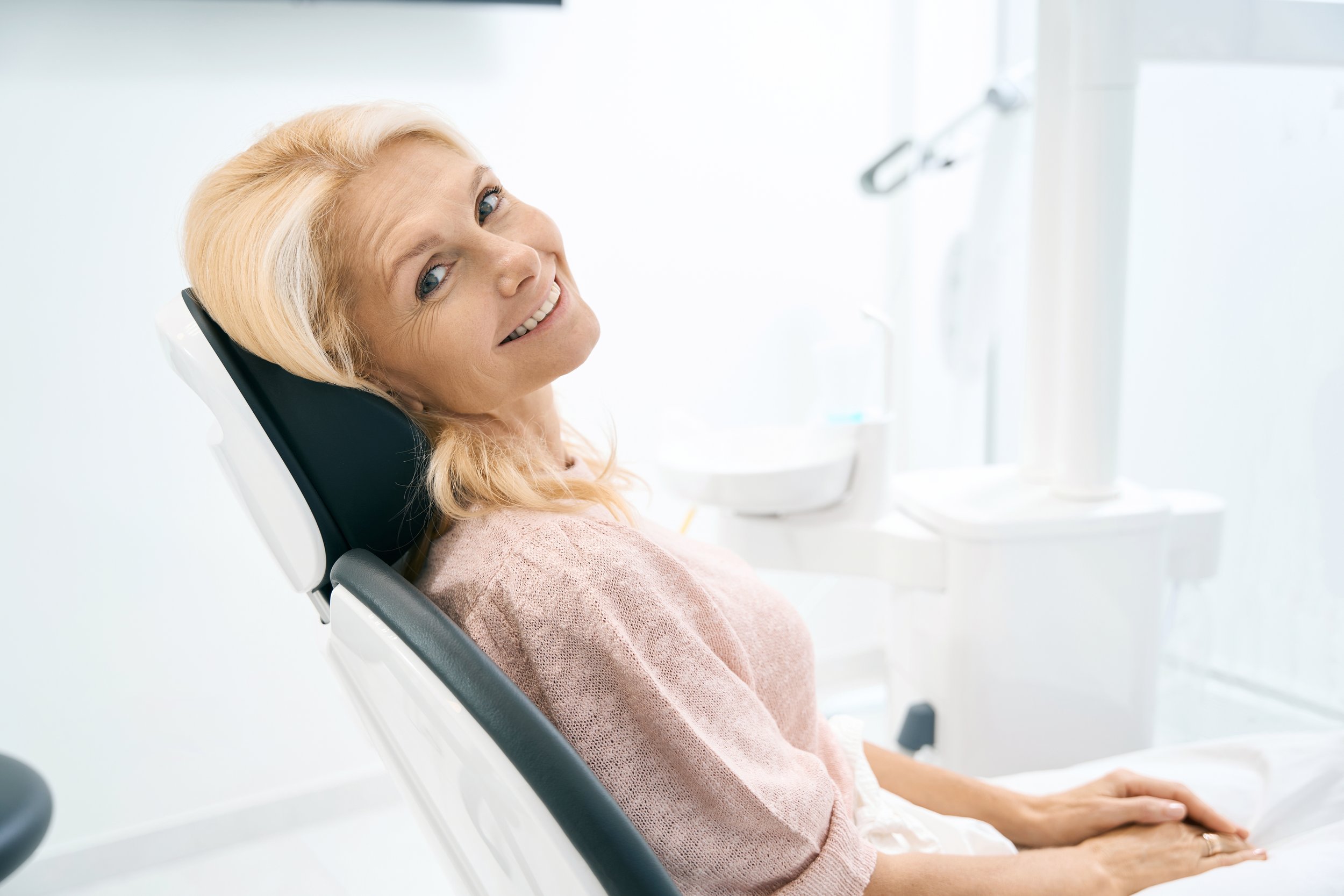 happy woman after a dental crown placement