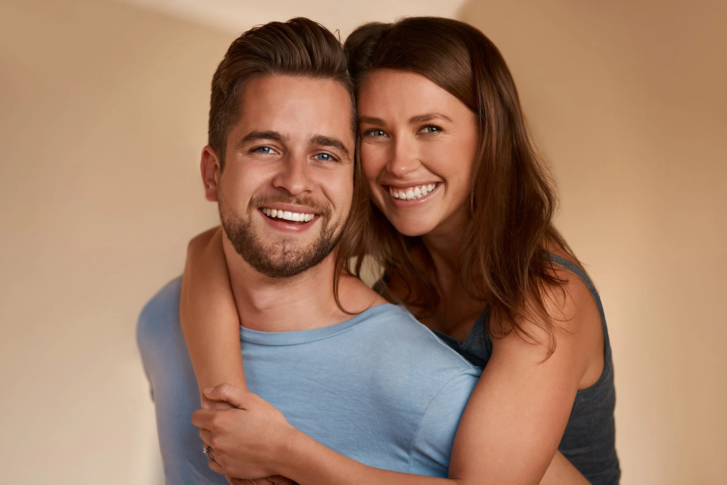 couple with healthy smiles shows results of learning how to keep your teeth and gums healthy
