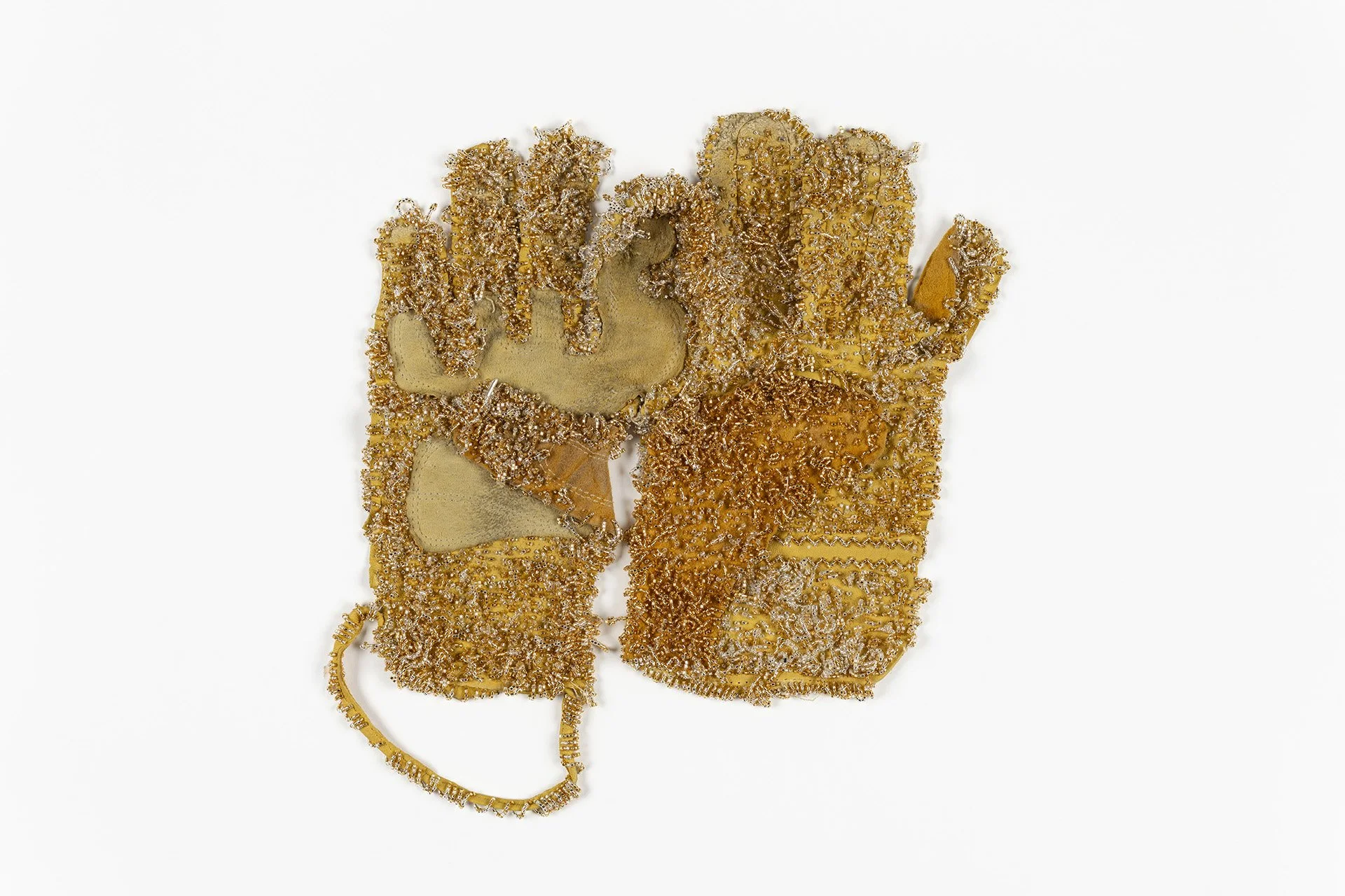 Labor Objects: adornment X, found calfskin work glove, gold and silver seed beading, 12”w x 9”h, 2026