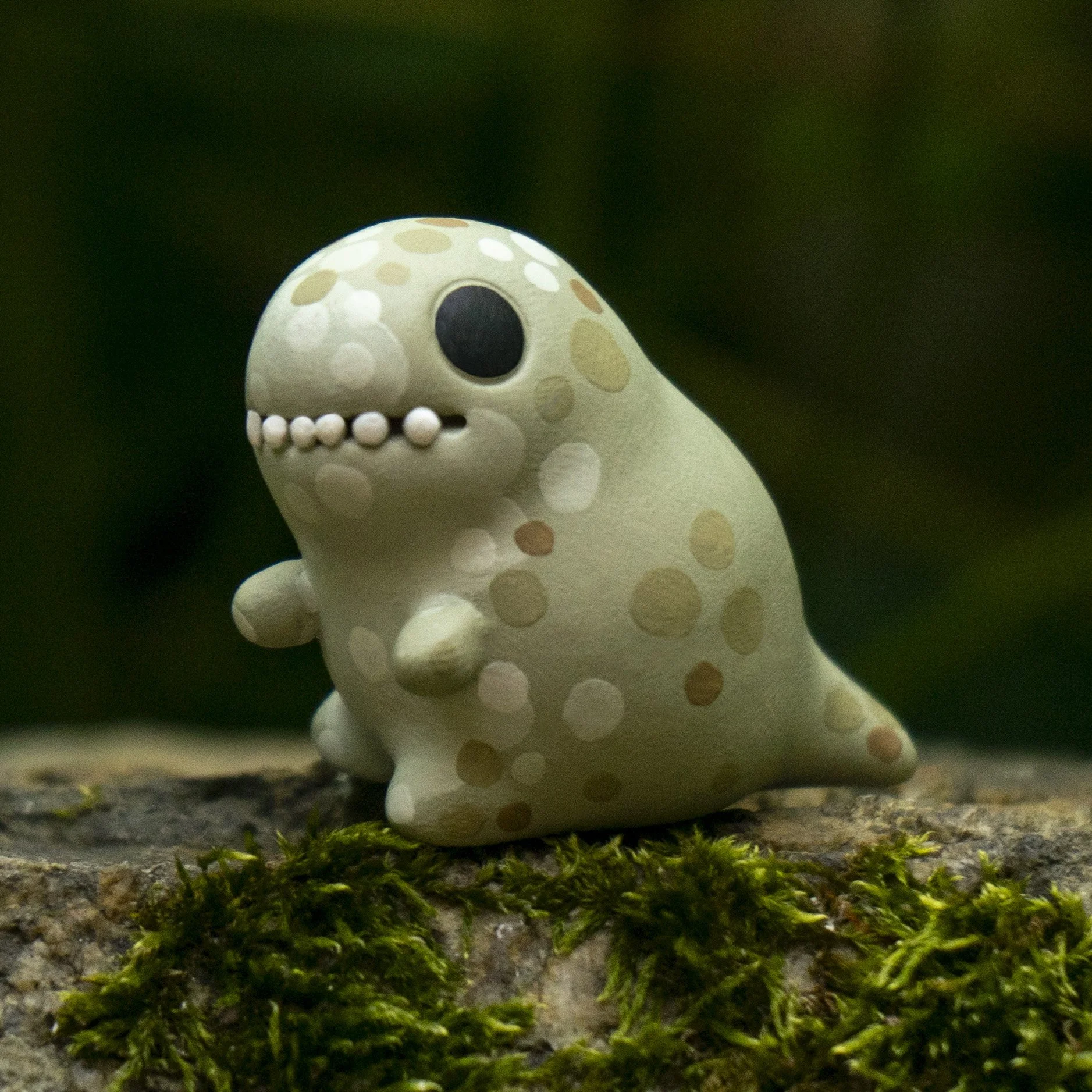 Tiny blue polymer clay t-rex dinosaursculpture
