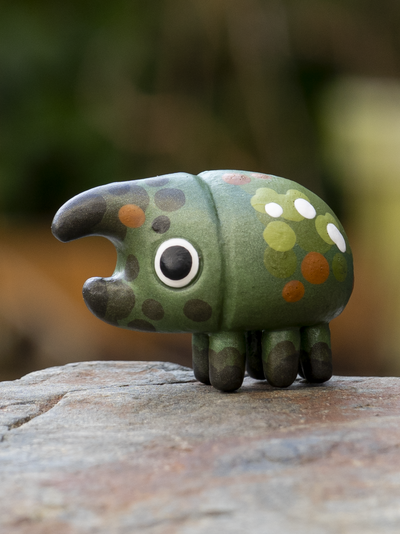 Tiny blue polymer clay green beetle sculpture