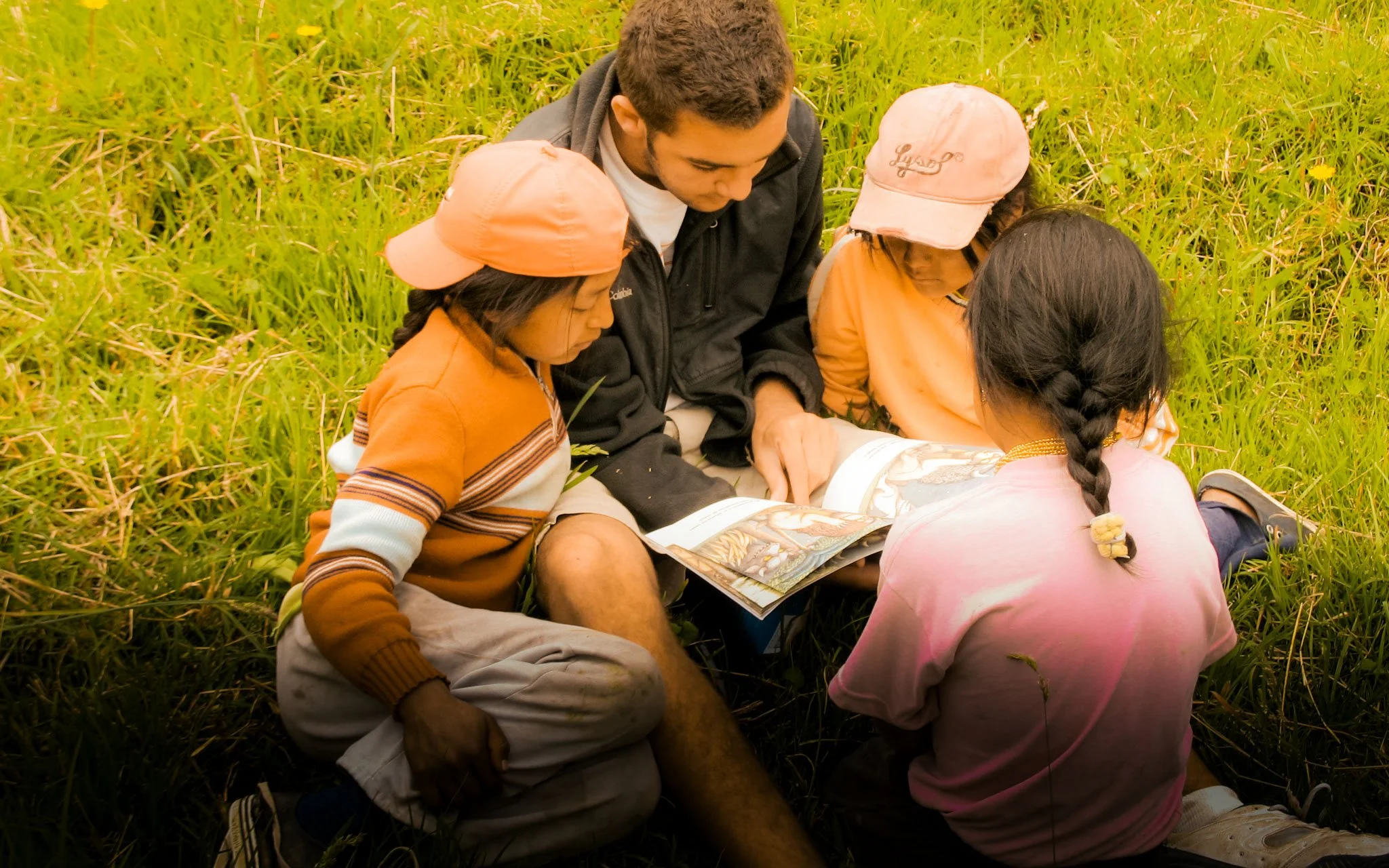  Reading with students during educational outreach days. 