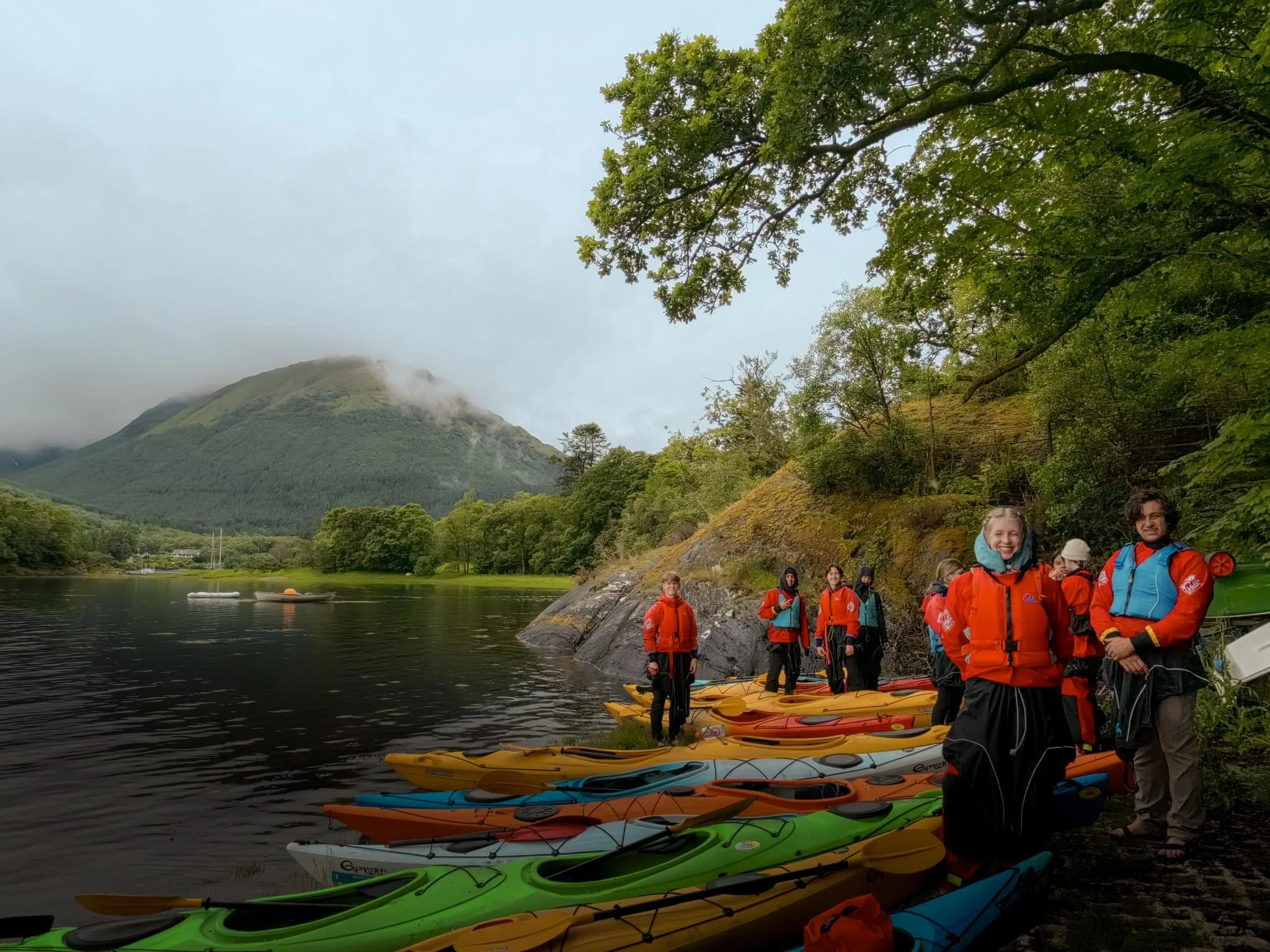  Kayak calm coastal waters between ocean &amp; mountain peaks. 