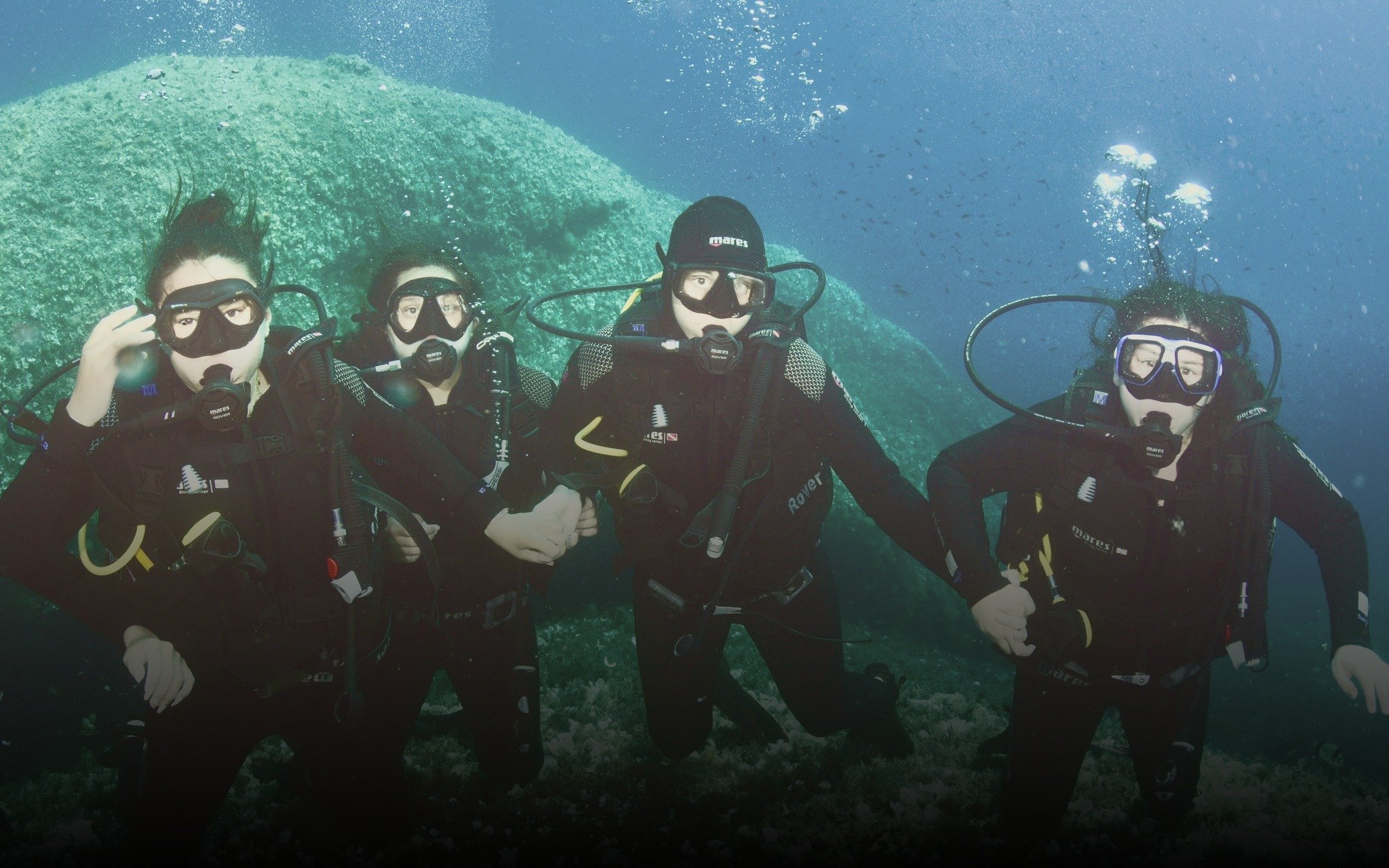  Scuba diving together off the coast of Sardinia. 