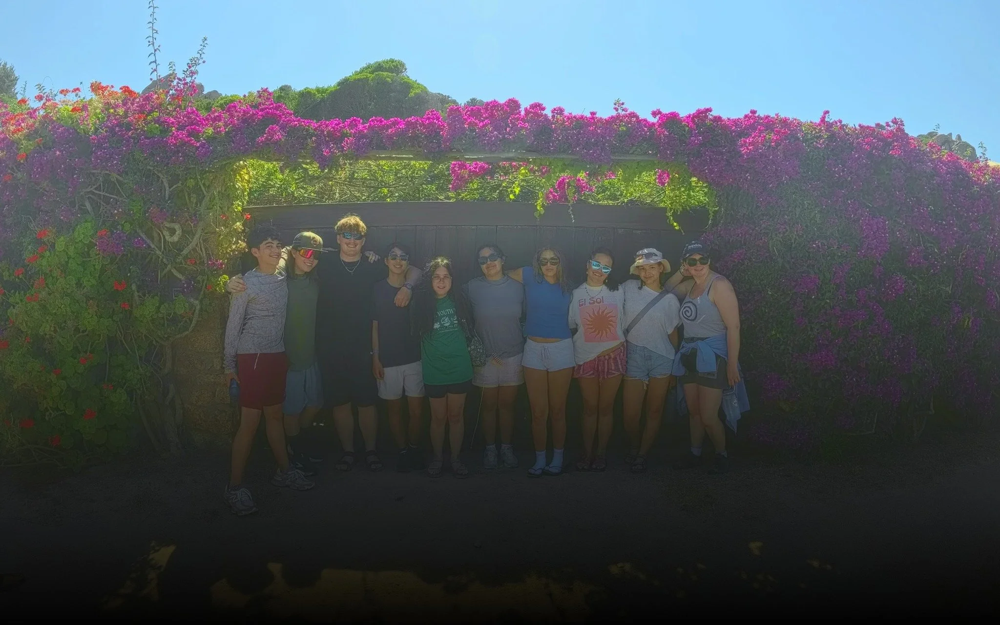  Group photo under a wall of bougainvillea. 