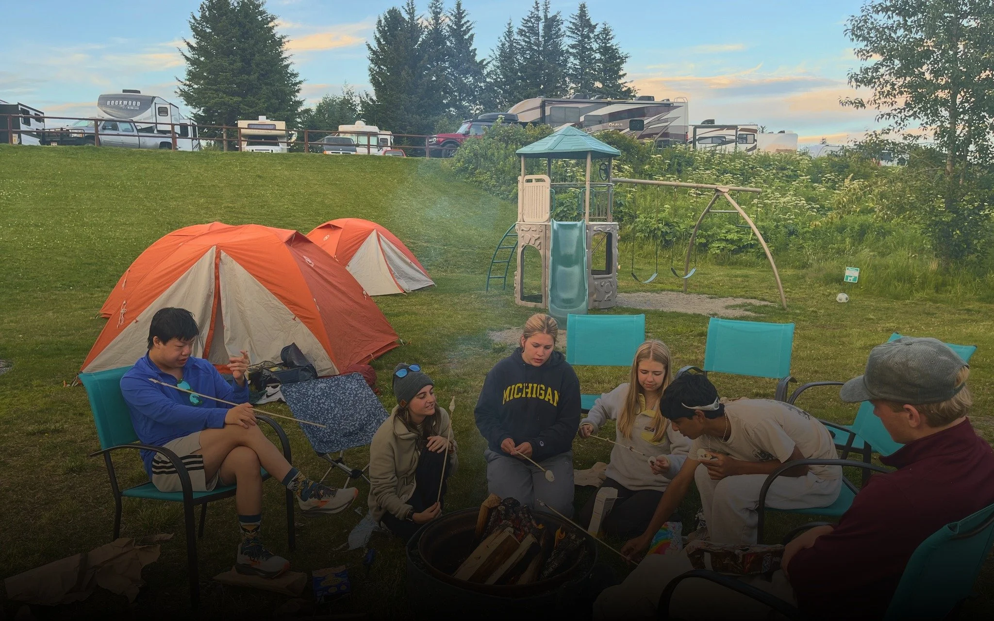  Tents up and a campfire going at camp. 