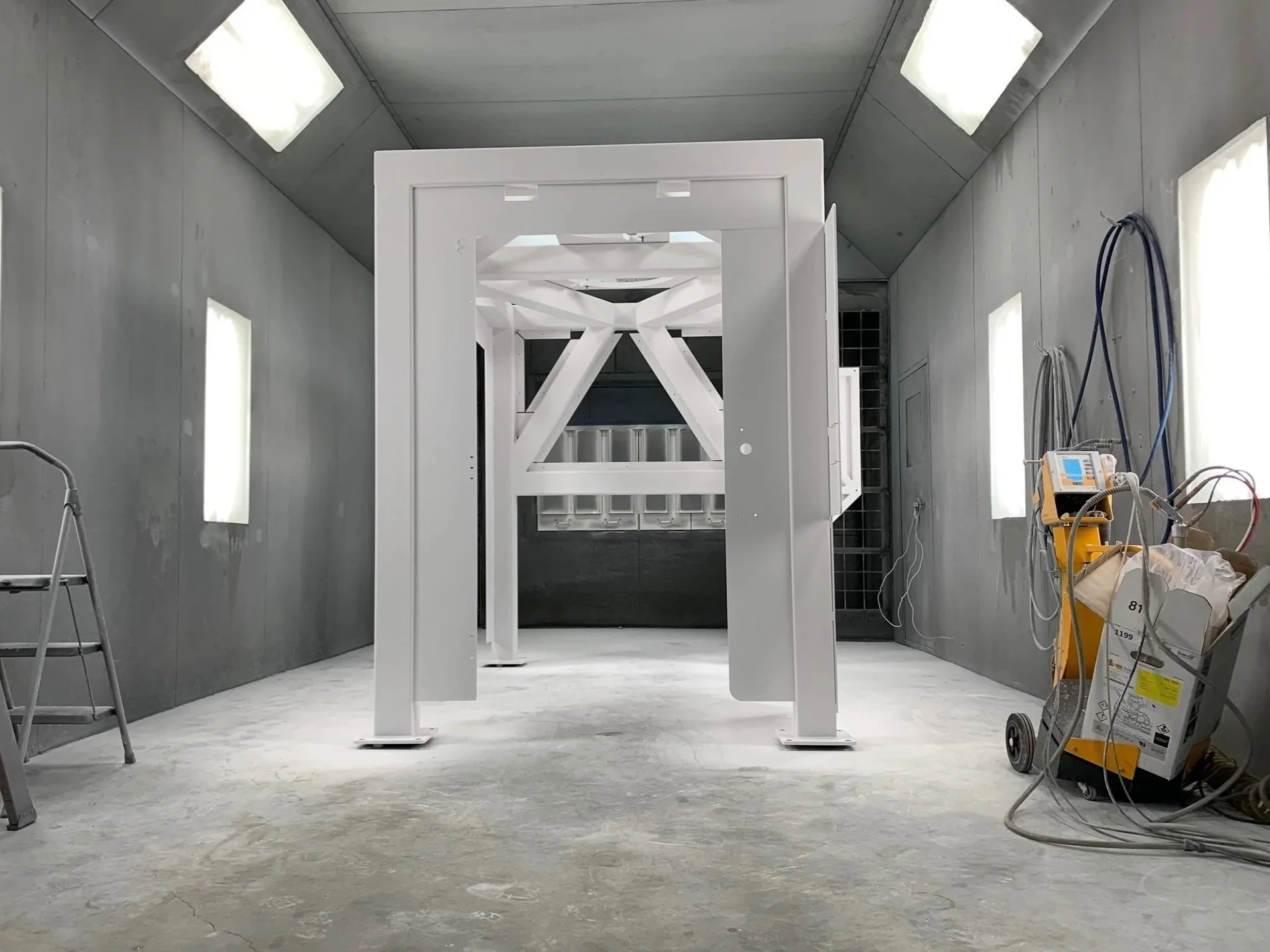 Large frame in the process of powder coating