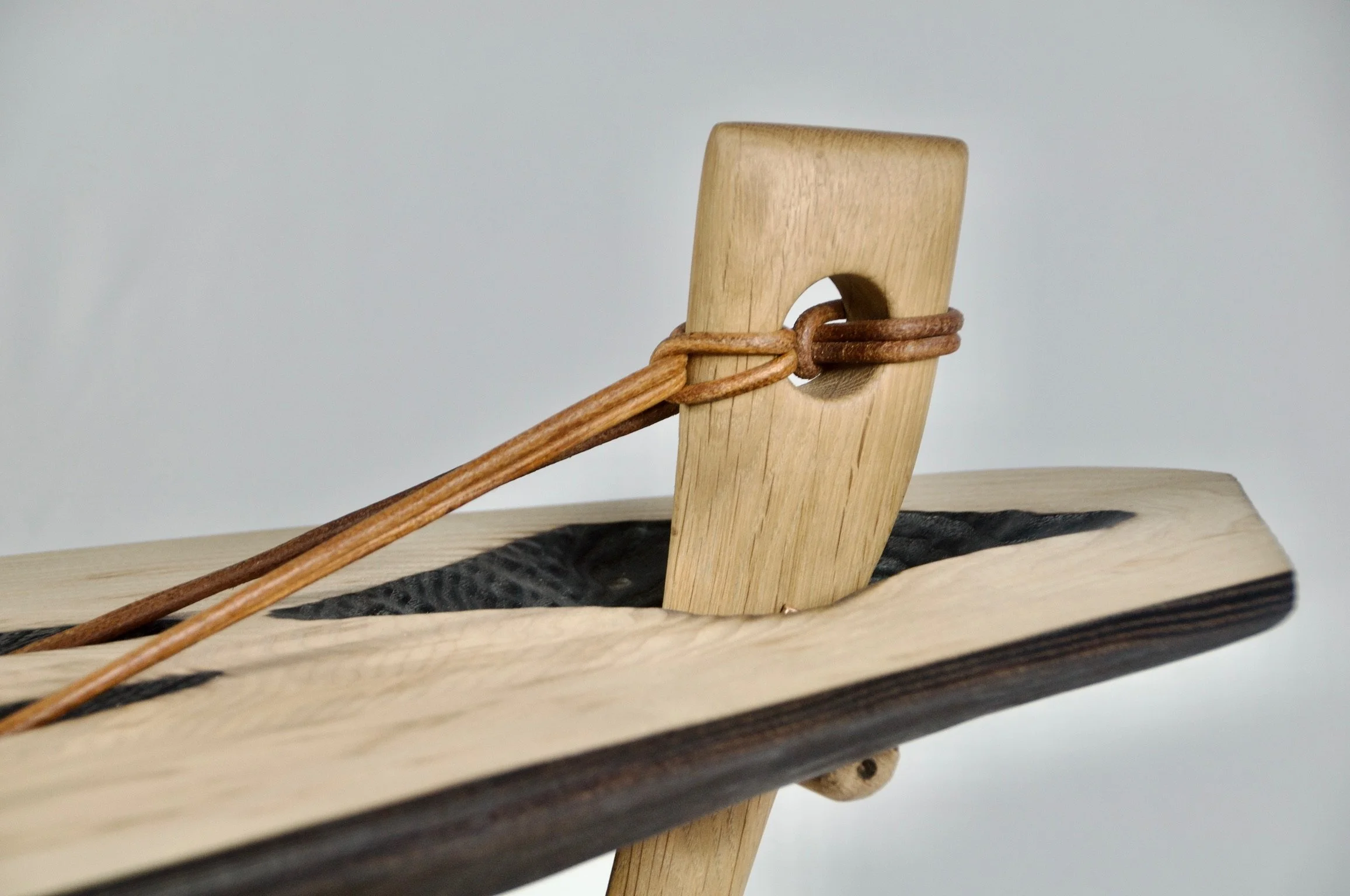 In-tension - sculptural occasional table - ash & oak with leather tensioning - available POA 