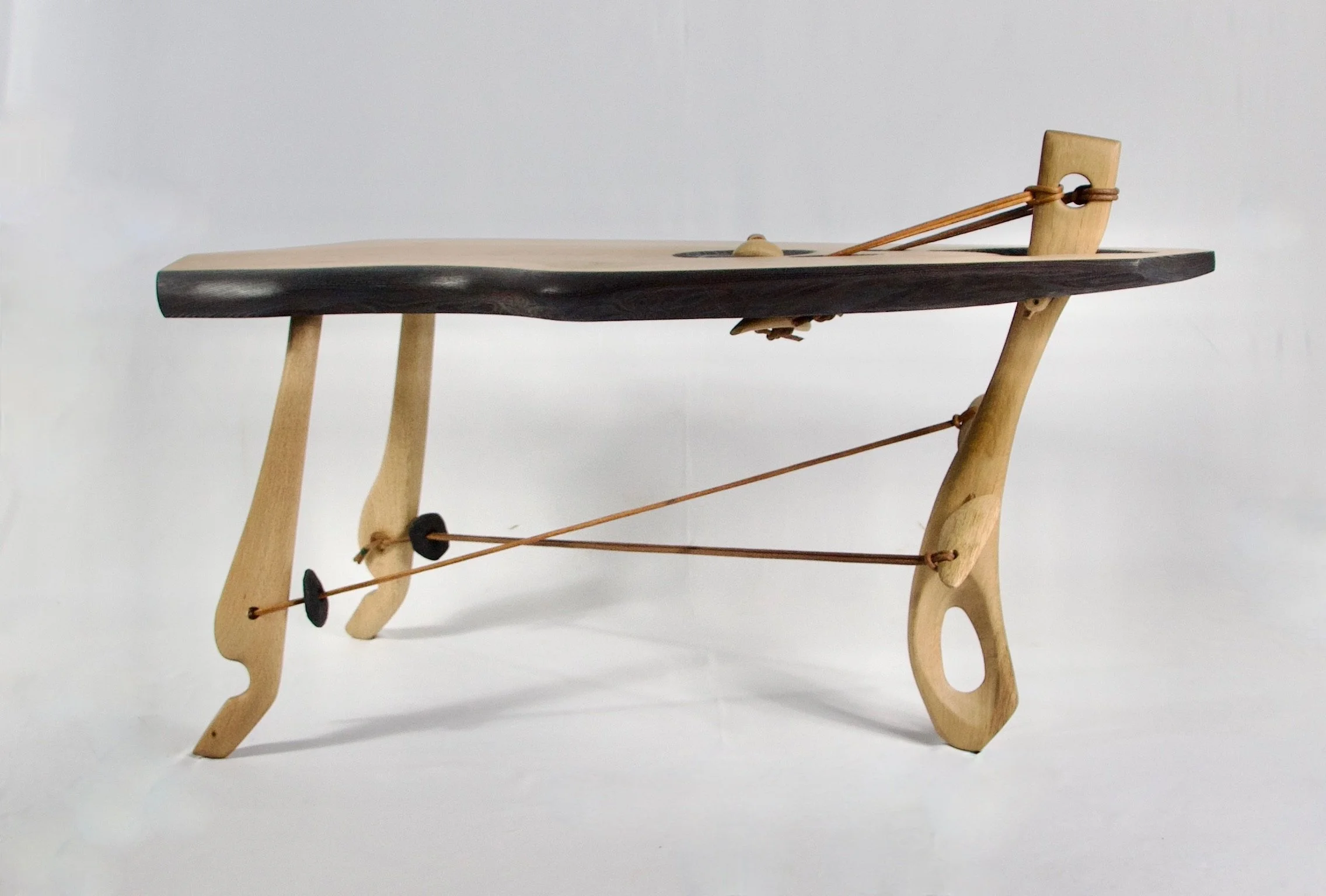 In-tension sculptural occasional table - ash & oak with leather tensioning - available POA 