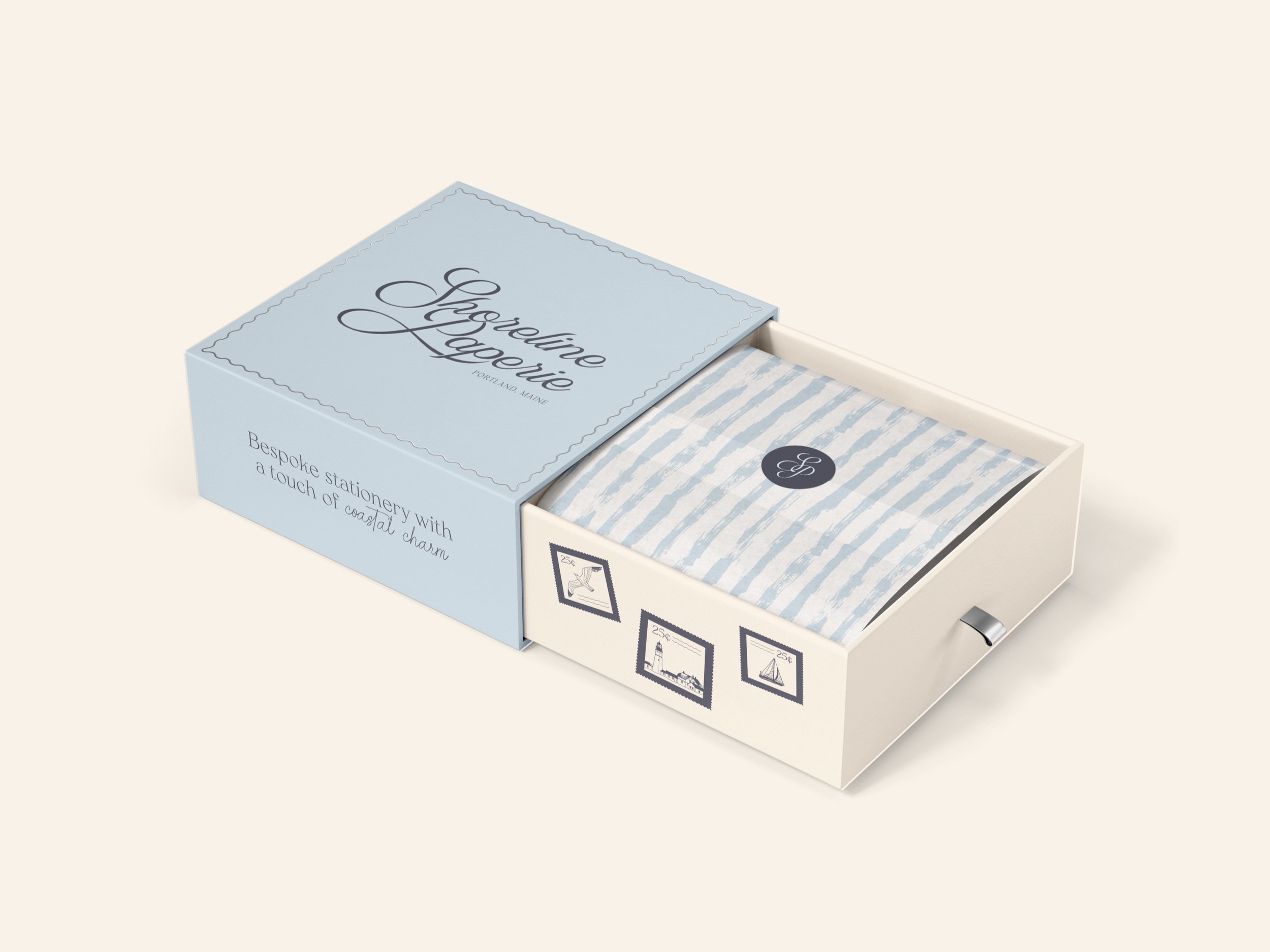 A luxury shipping box with Shoreline Paperie branding applied.