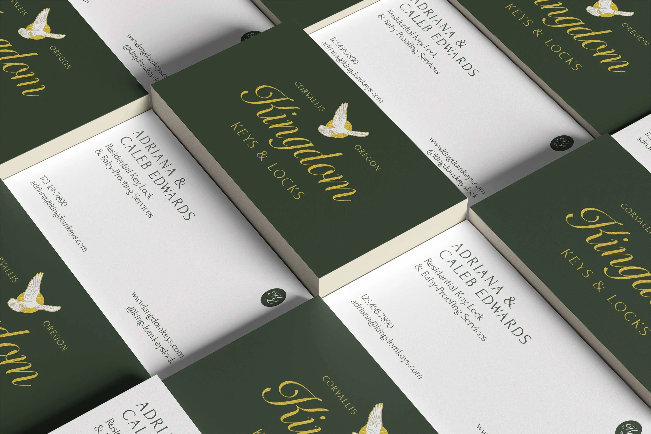 Sample designed business cards for the Kingdom Keys & Locks brand lay orderly on a flat surface.