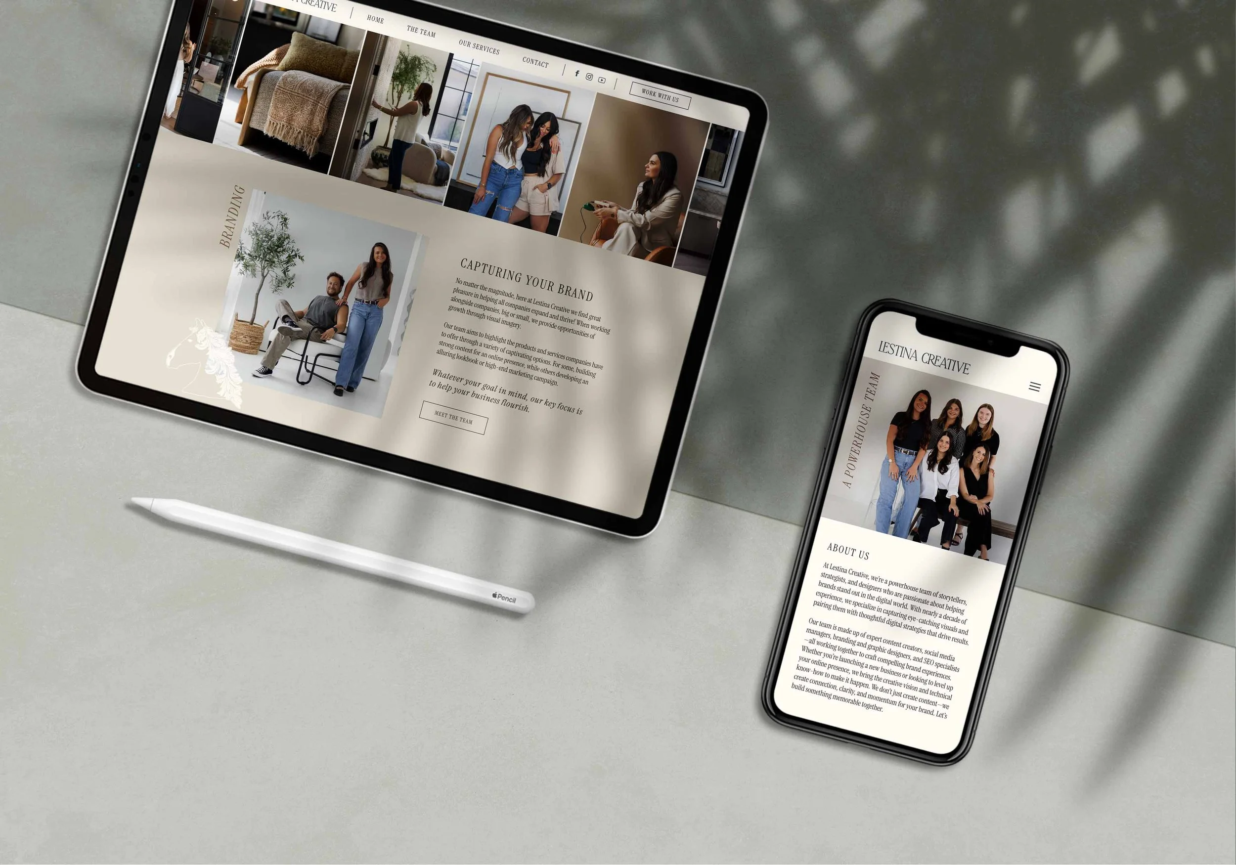 An iPad and an iPhone laying flat on a two-tone surface, displaying screenshots from the Lestina Creative website.