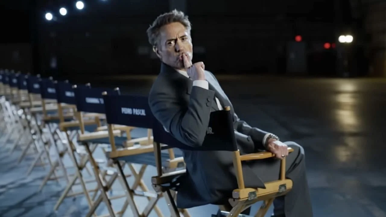 Robert Downey Jr. is making a shush gesture in the director chair line-up