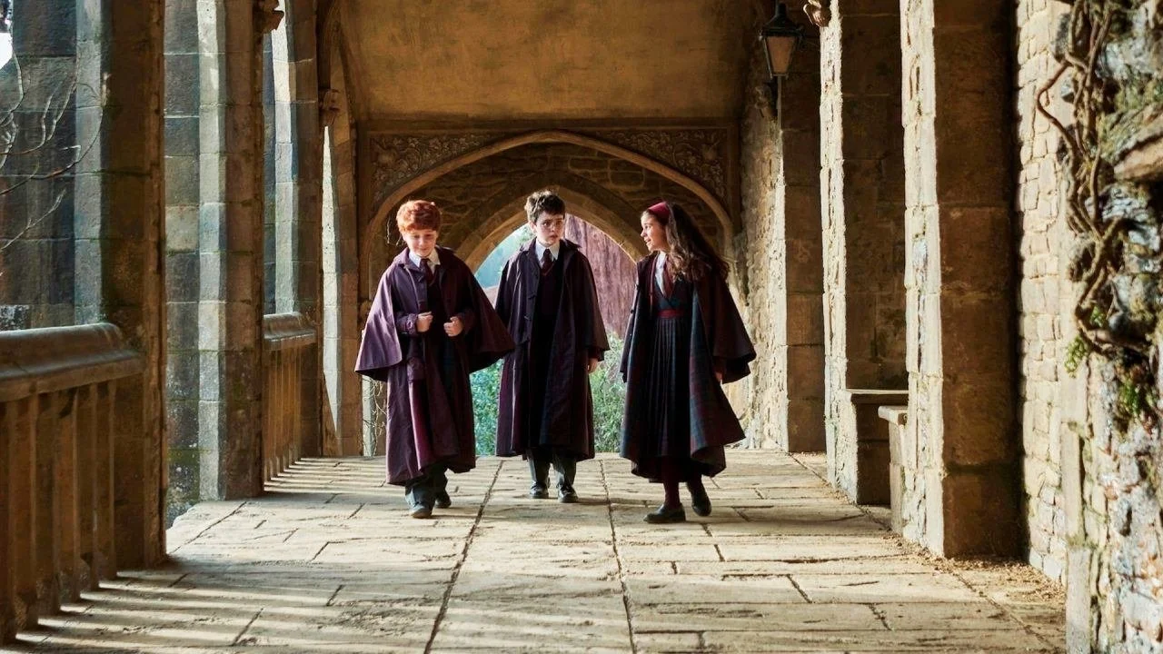 The “golden trio” of Harry Potter, flanked by Hermione Granger and Ron Weasley walking together