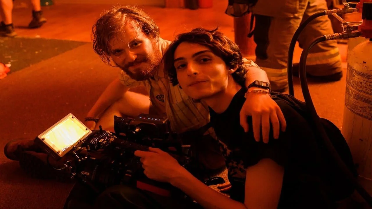 Fred Hechinger and Finn Wolfhard on the set of Hell of a Summer Image Source: NME