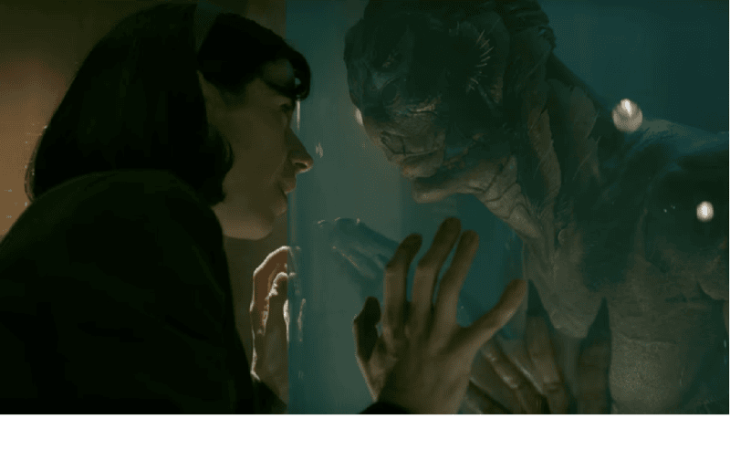 Image Description: Elisa and Amphibian Man looking at each other