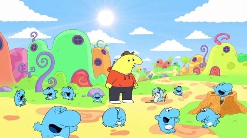 Charlie the Smiling Friend surrounded by Shmaloogles with a slightly frustrated look on his face