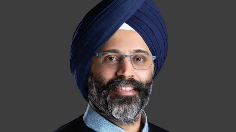 Headshot of Karandeep Anand with a dark grey background from The Walt Disney Company's website.