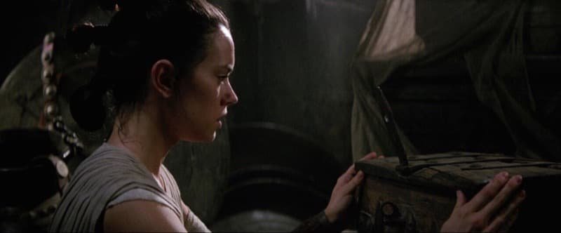 Rey discovers the Skywalker lightsaber  Image Source: StarWars.com