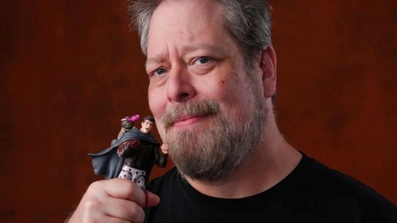 Matt Dinniman holding an action figure of Carl and Donut