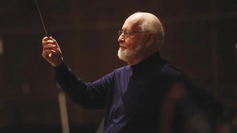 John Williams conducting the orchestra performing the score for The Rise of Skywalker.