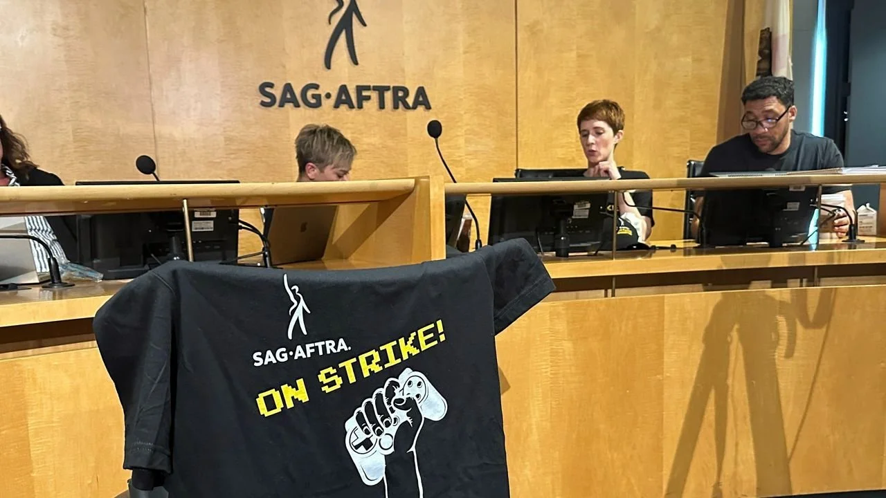 SAG-AFTRA meeting room, featuring a strike t-shirt.