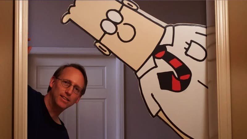 Adams and a Dilbert cut-out peeking through a doorway