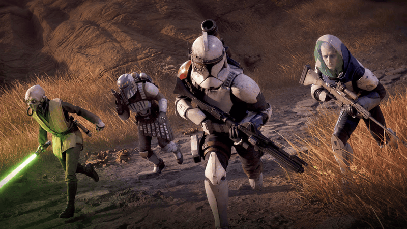 A Jedi, Mandalorian, Clone Trooper, and Umbaran run along a grassy path with weapons drawn  Image Source: EA