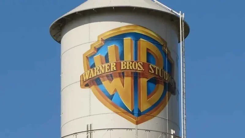 Old water tower design at the Warner Bros. lot in California, crest reads Warner Bros. Studios against the blue and gold WB crest.  Image Source: Warner Bros. Entertainment Wiki
