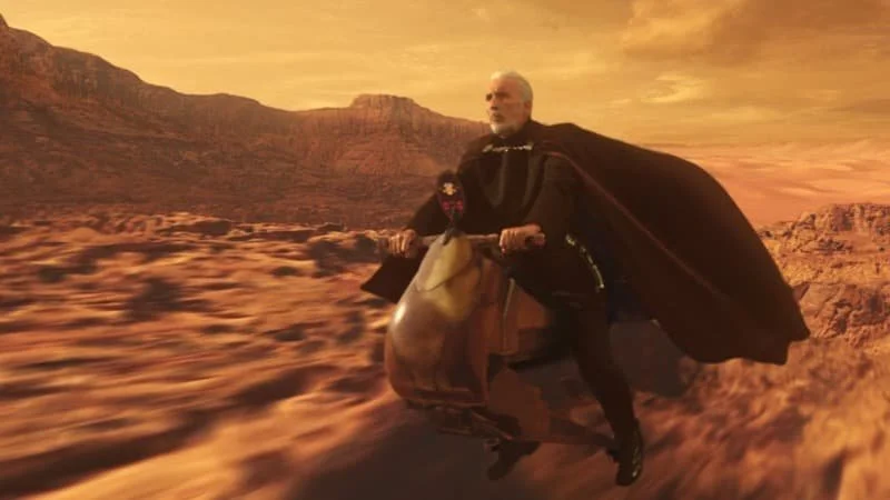 Dooku fleeing the Geonosian Arena on a flitknot speeder  Image Source: StarWars.com