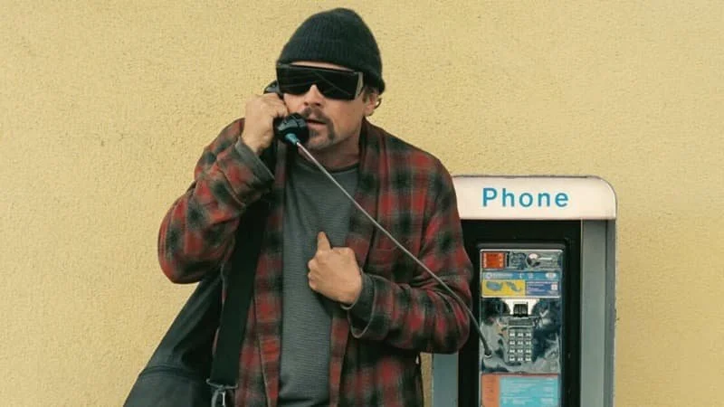 Image Description: Leo DiCaprio’s character on the phone