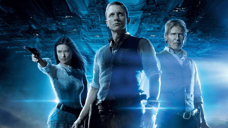 Olivia Wilde, Daniel Craig, and Harrison Ford on the poster for Cowboys and Aliens