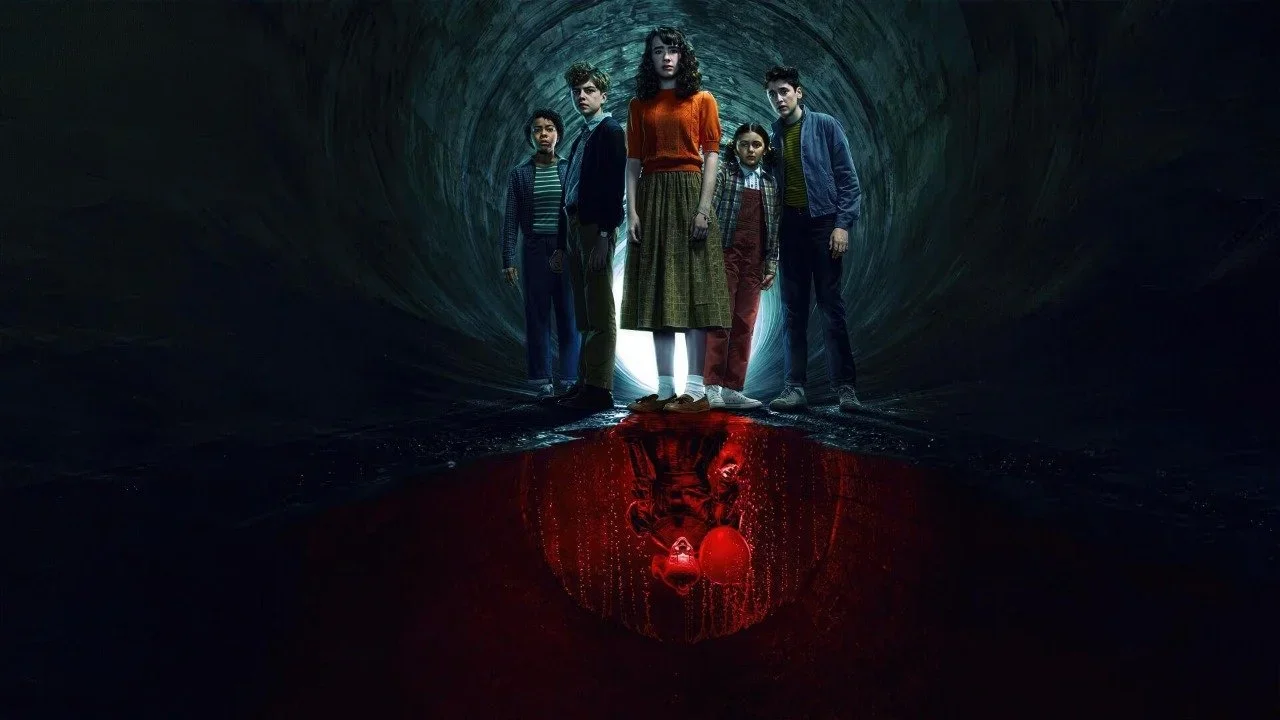Left to right: Amanda Christine as Ronnie Grogan, Mikkal Karim-Fidler as Teddy Uris, Clara Stack as Lilly Bainbridge, Matilda Legault as Susie Malkin, and Jack Molloy Legault as Phil Malkin in a promo image for It: Welcome to Derry