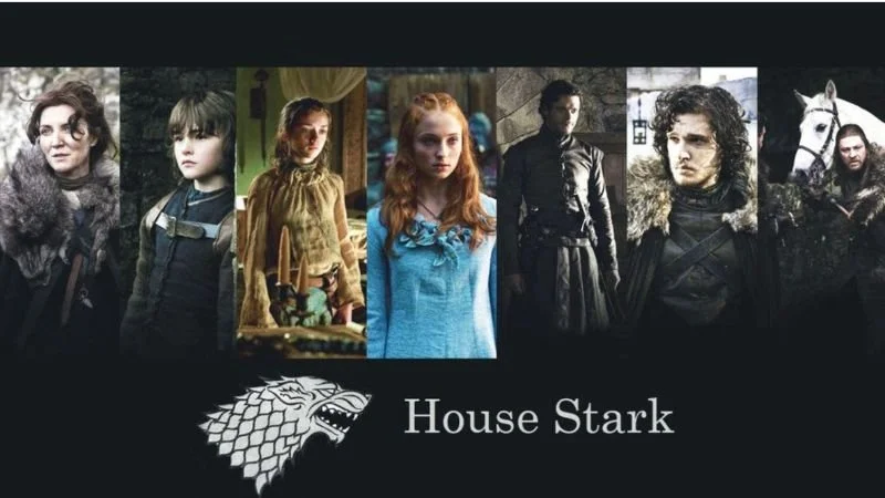 Pictures of the Present Stark Family on a black background over a white dire wolf head and “House Stark” in white lettering