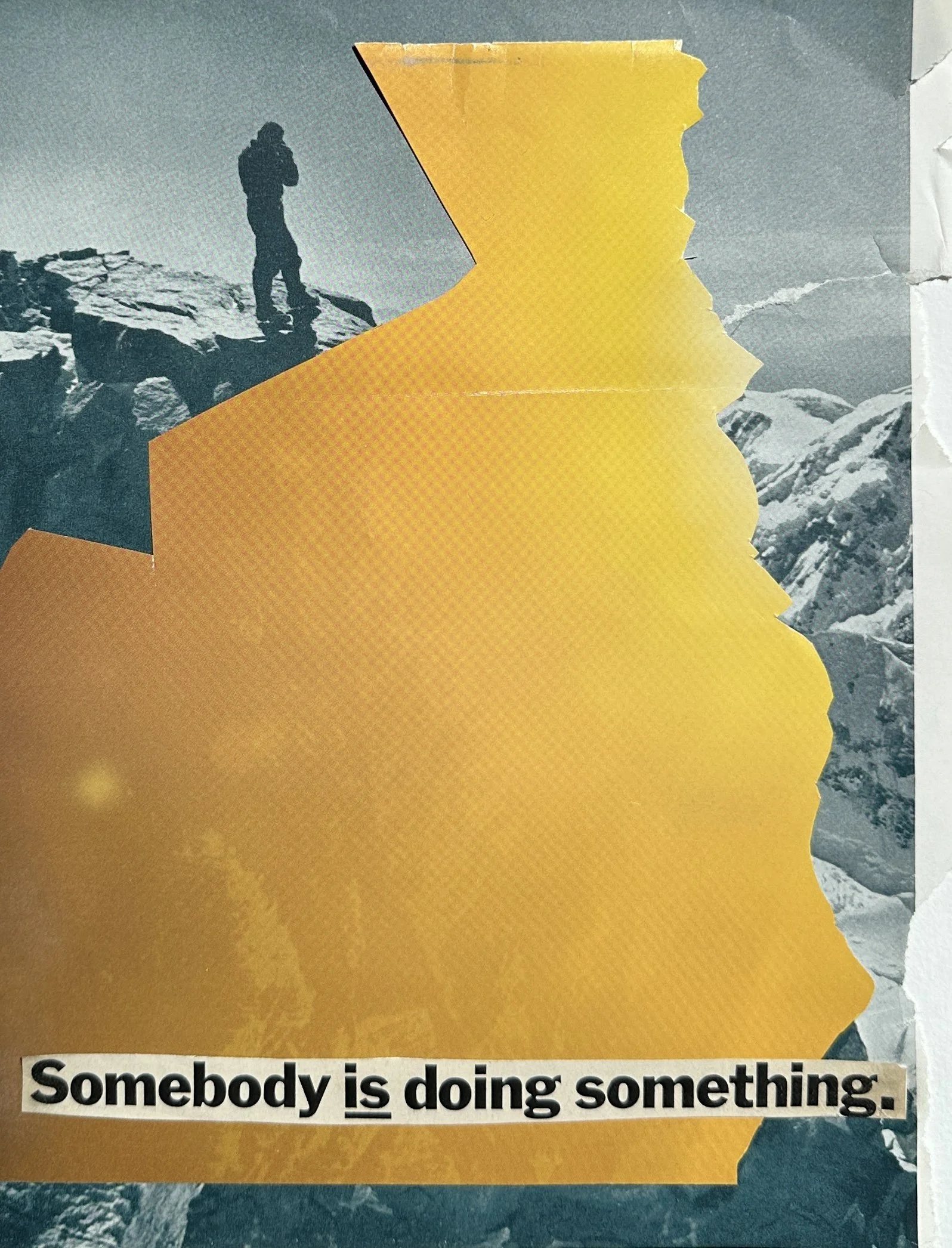 Collage image of a solitary figure standing on a snowy mountain ridge beneath a large, angular cutout of bright yellow paper, set against a gray-blue sky.