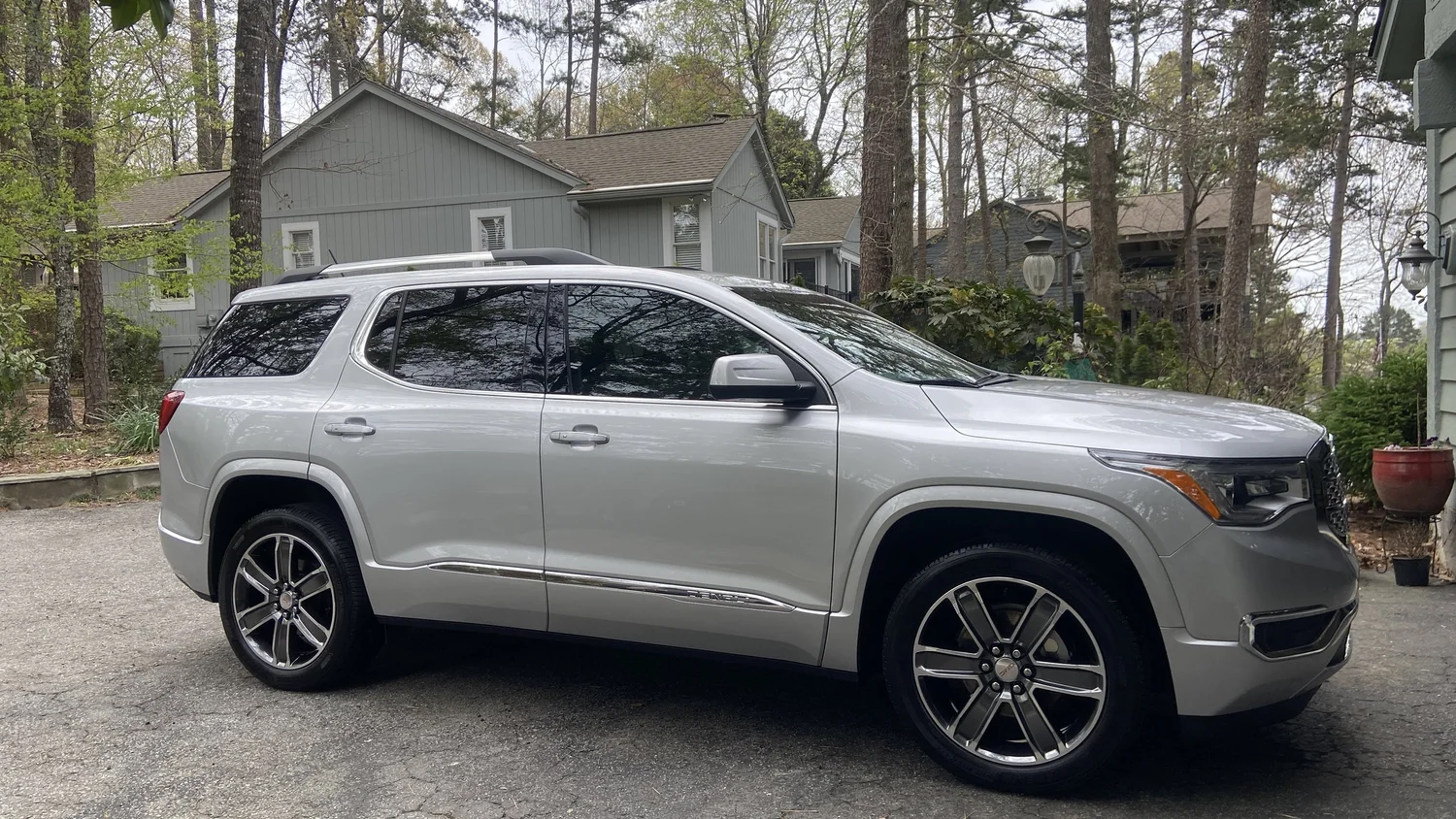 Mobile ceramic coating in Salem, South Carolina — silver GMC Acadia Denali detailed in a driveway near Lake Keowee