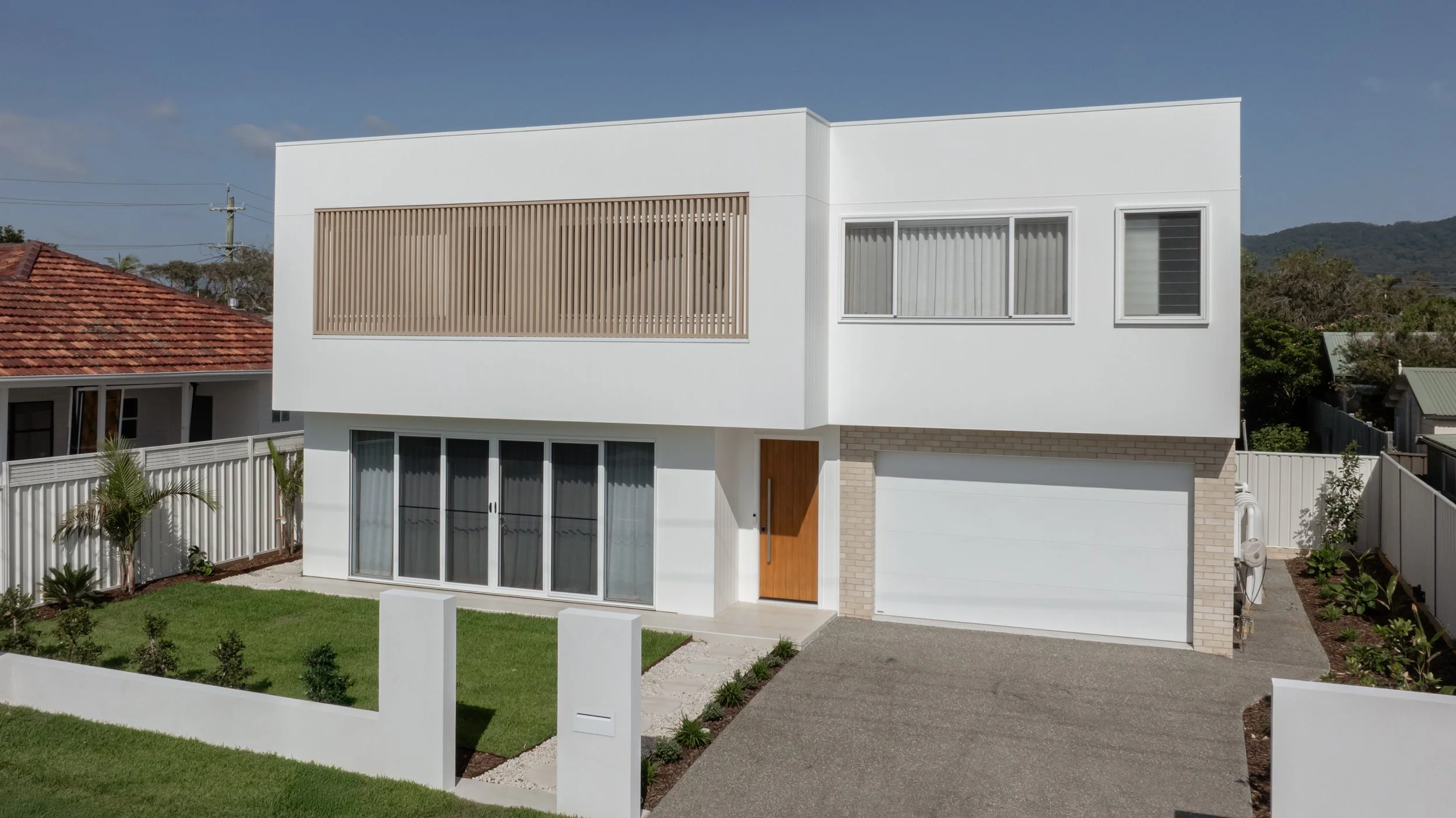 Towradgi corner block custom home facade — modern coastal design by TAG Homes