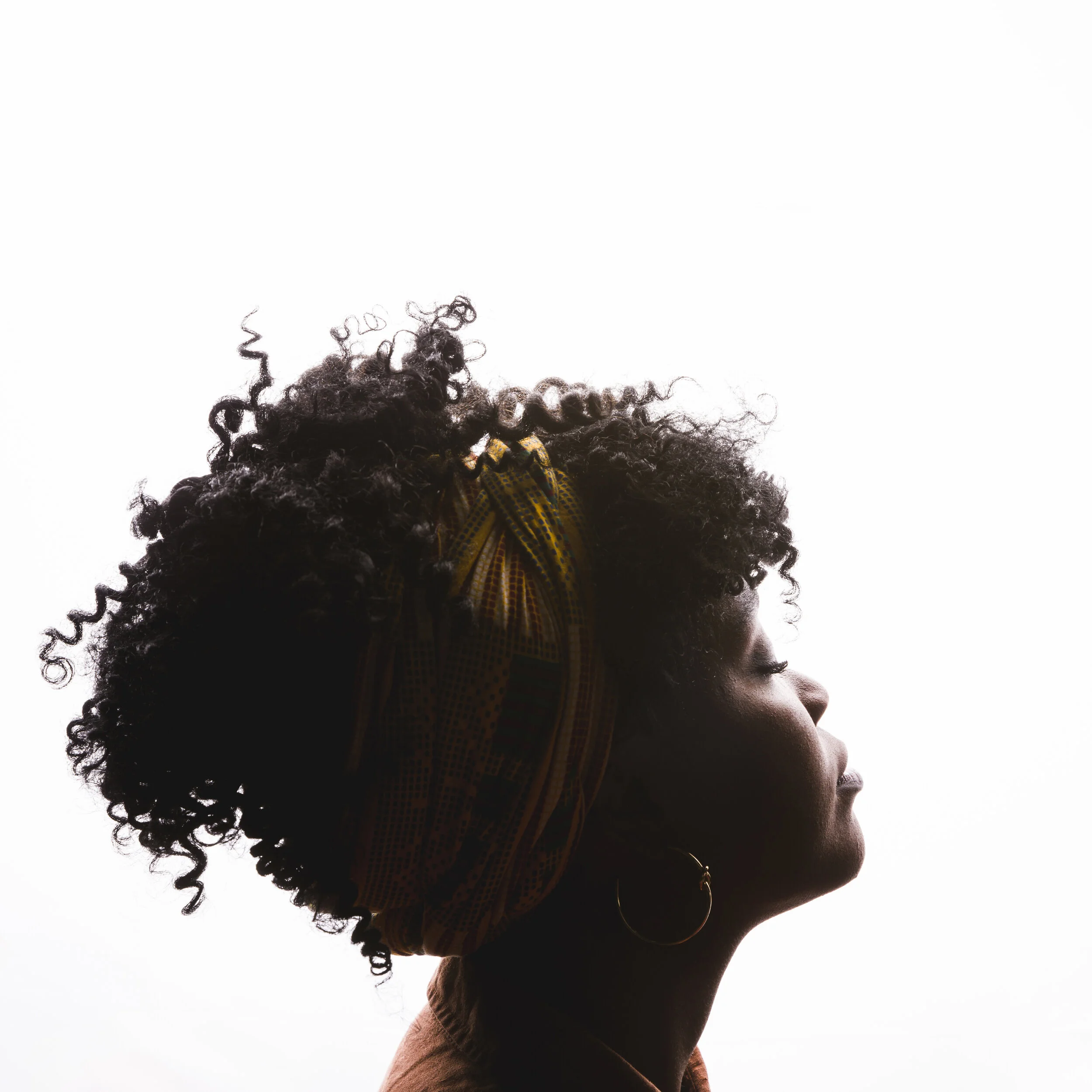 profile-of-young-curly-african-american-female-on-white-background.jpg
