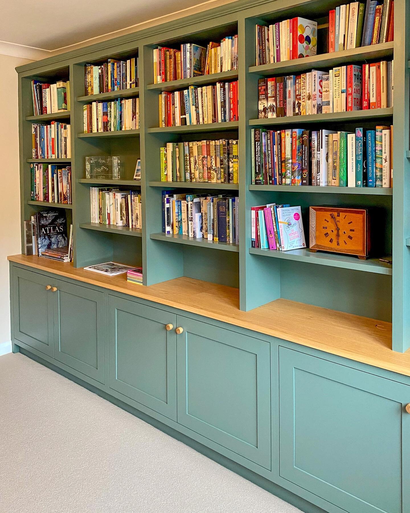 Our client&rsquo;s large collection of books meant they had a very clear idea of how this bookcase would look and how it needed to work for them. Hand painted in Farrow and Ball Green Smoke, with an oiled oak top to the base cabinets, it is now fille