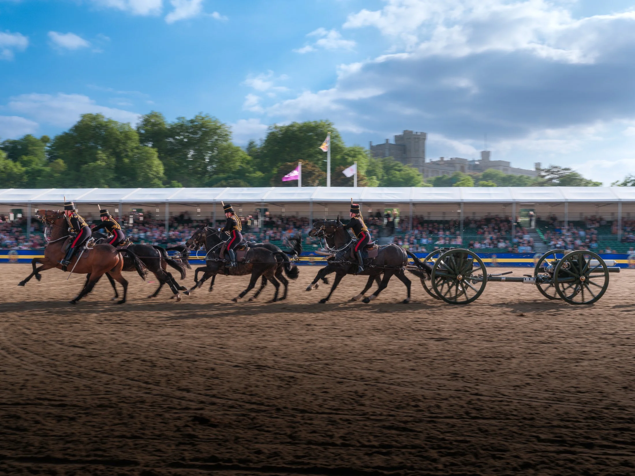 The King's Troop gallop with gun carriages around the arena.