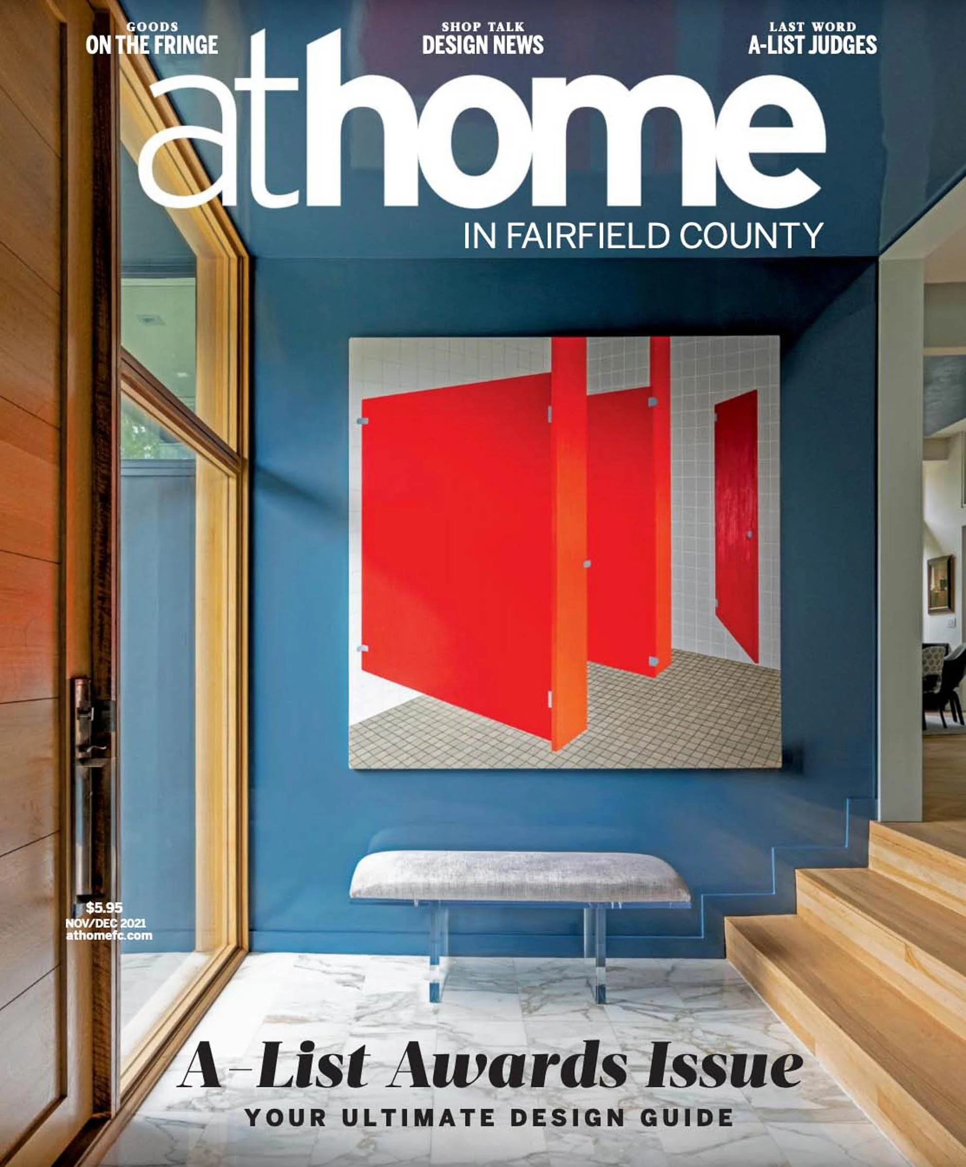 Cover of a magazine titled 'at home in Fairfield County.' The image depicts a modern interior with a blue wall, a large art piece with red panels, a transparent bench, and a marble-tiled floor. The issue is labeled as the 'A-List Awards Issue' and is