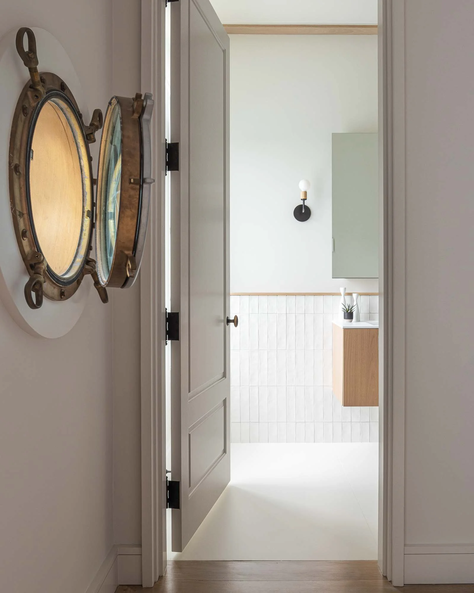 view into bathroom with porthole window