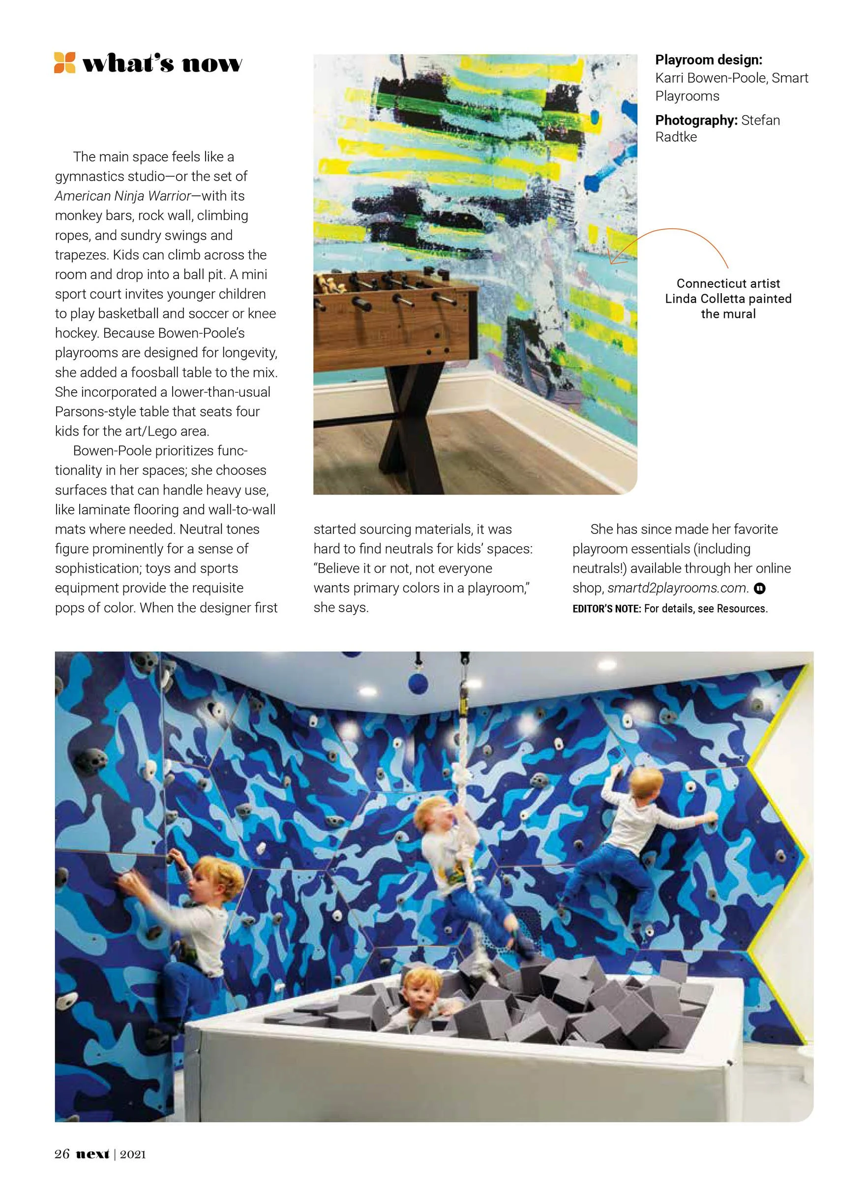 Interior of a playroom designed by Karri Bowen-Poole with a rock climbing wall, ball pit, and wall mural by Linda Colletta. Features three children climbing and playing.